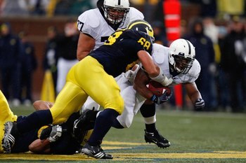 ANN ARBOR, MI - OCTOBER 24:  Mike Martin #68 of the Michigan Wolverines tackles Brandon Beachum #3 of the Penn State Nittany Lions on October 24, 2009 at Michigan Stadium in Ann Arbor, Michigan. (Photo by  Gregory Shamus/Getty Images)