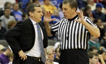 KANSAS CITY, MO - MARCH 11:  Head coach Mark Turgeron of the Texas A&M Aggies talks with a referee in the first half while taking on the Nebraska Cornhuskers during the quarterfinals of the 2010 Phillips 66 Big 12 Men's Basketball Tournament at the Sprint