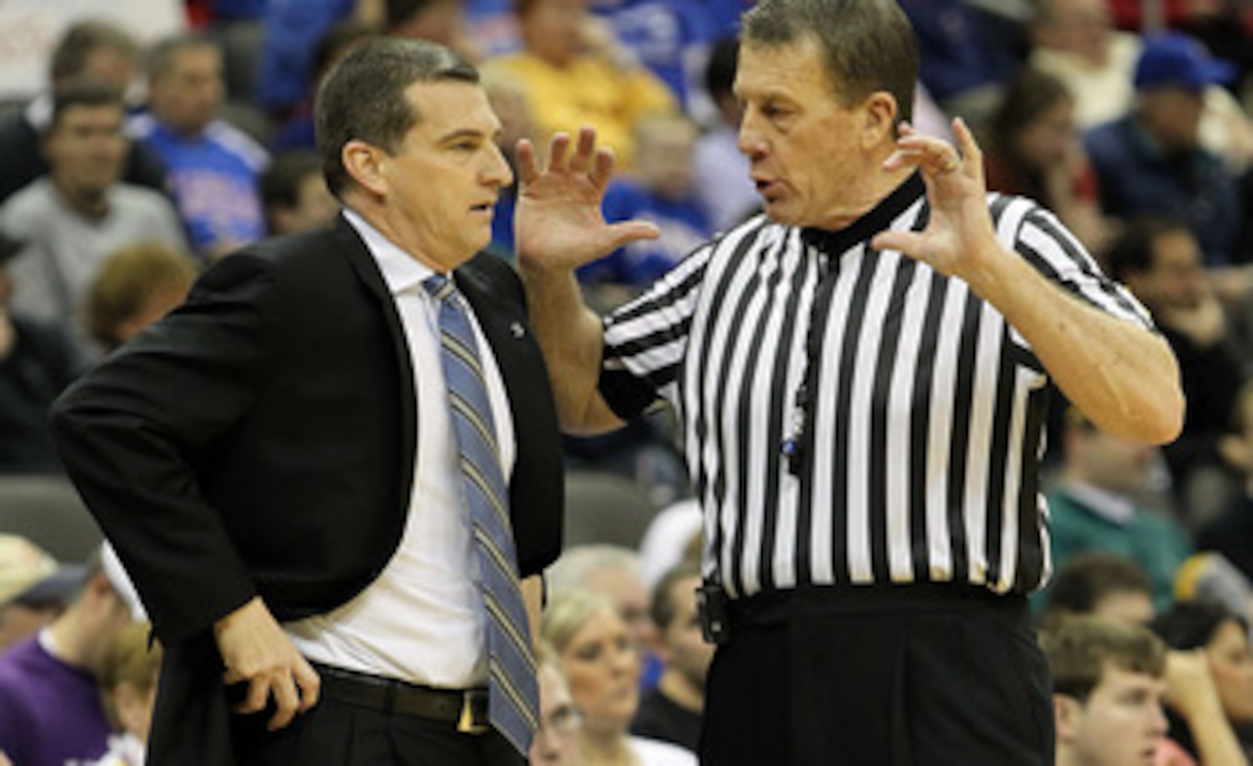 KANSAS CITY, MO - MARCH 11:  Head coach Mark Turgeron of the Texas A&M Aggies talks with a referee in the first half while taking on the Nebraska Cornhuskers during the quarterfinals of the 2010 Phillips 66 Big 12 Men's Basketball Tournament at the Sprint