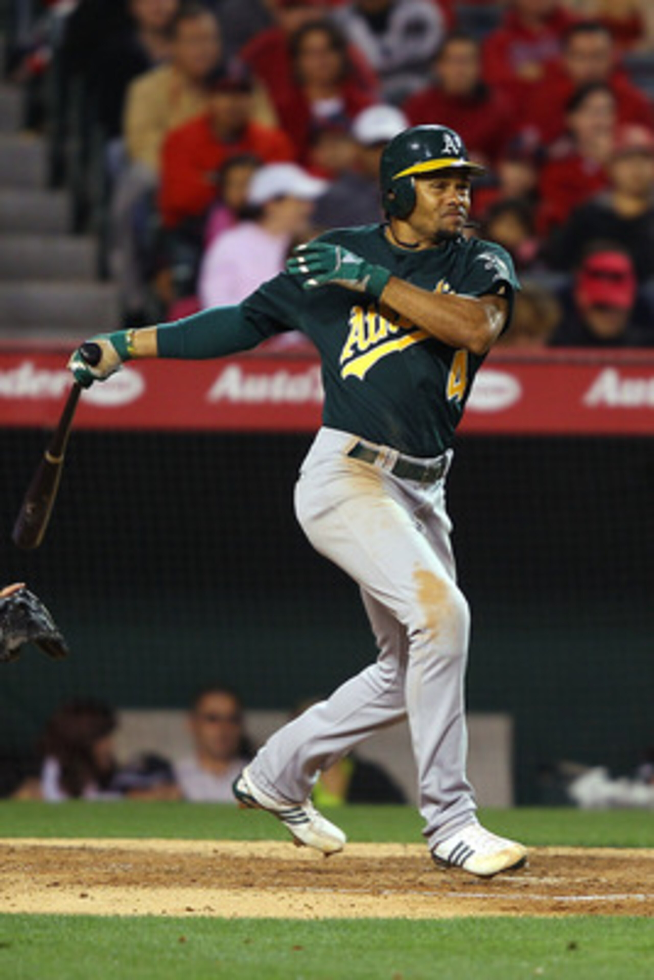 ANAHEIM, CA - MAY 23: Coco Crisp #4 of the Oakland Athletics singles in the seventh inning on a line drive to right field during the game against the Los Angeles Angels of Anaheim at Angel Stadium on May 23, 2011 in Anaheim, California. (Photo by Joe Sc ANAHEIM, CA - MAY 23: Coco Crisp #4 of the Oakland Athletics singles in the seventh inning on a line drive to right field during the game against the Los Angeles Angels of Anaheim at Angel Stadium on May 23, 2011 in Anaheim, California. (Photo by Joe Sc