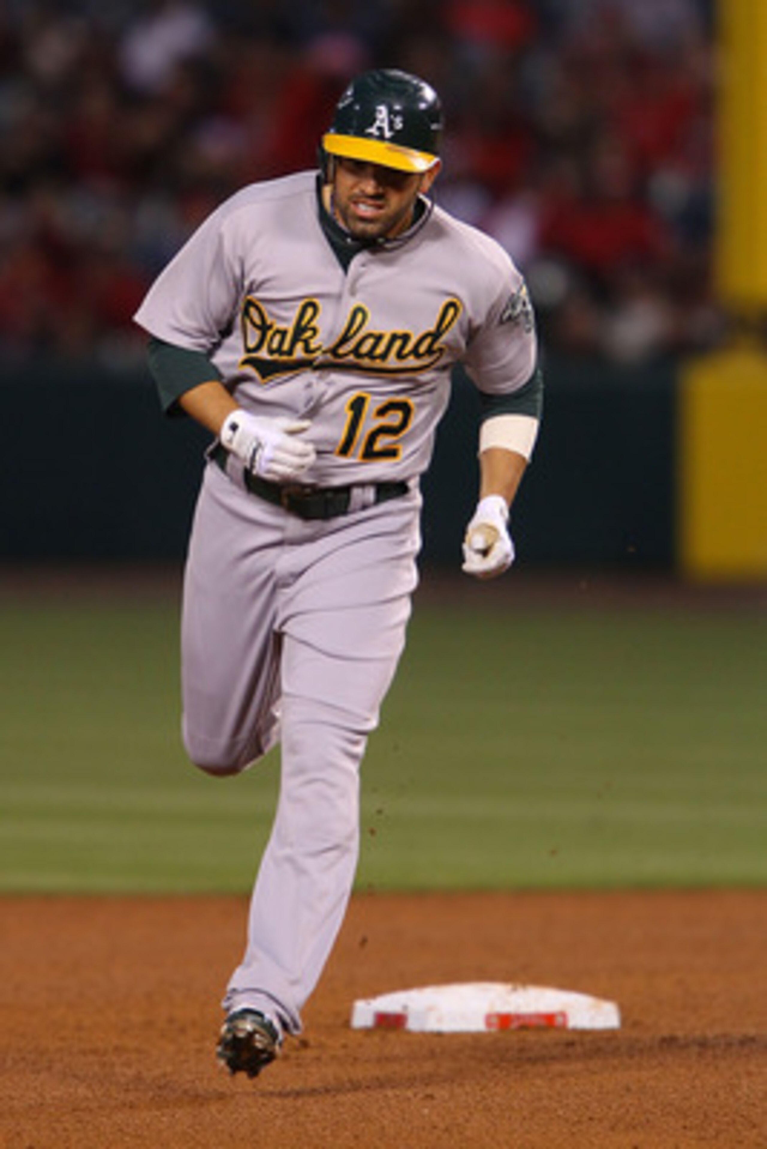 ANAHEIM, CA - MAY 24: David DeJesus #12 of the Oakland Athletics runs the bases after a home run hit in the fourth inning during the game against the Los Angeles Angels of Anaheim at Angel Stadium on May 24, 2011 in Anaheim, California. (Photo by Joe Sc ANAHEIM, CA - MAY 24: David DeJesus #12 of the Oakland Athletics runs the bases after a home run hit in the fourth inning during the game against the Los Angeles Angels of Anaheim at Angel Stadium on May 24, 2011 in Anaheim, California. (Photo by Joe Sc