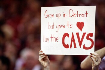 CLEVELAND - MAY 27:  A fan of the Cleveland Cavaliers holds up a sign reading 'Gre up in Detroit but grew to luv the Cavs' against the Detroit Pistons in Game Three of the Eastern Conference Finals during the 2007 NBA Playoffs on May 27, 2007 at the Quick