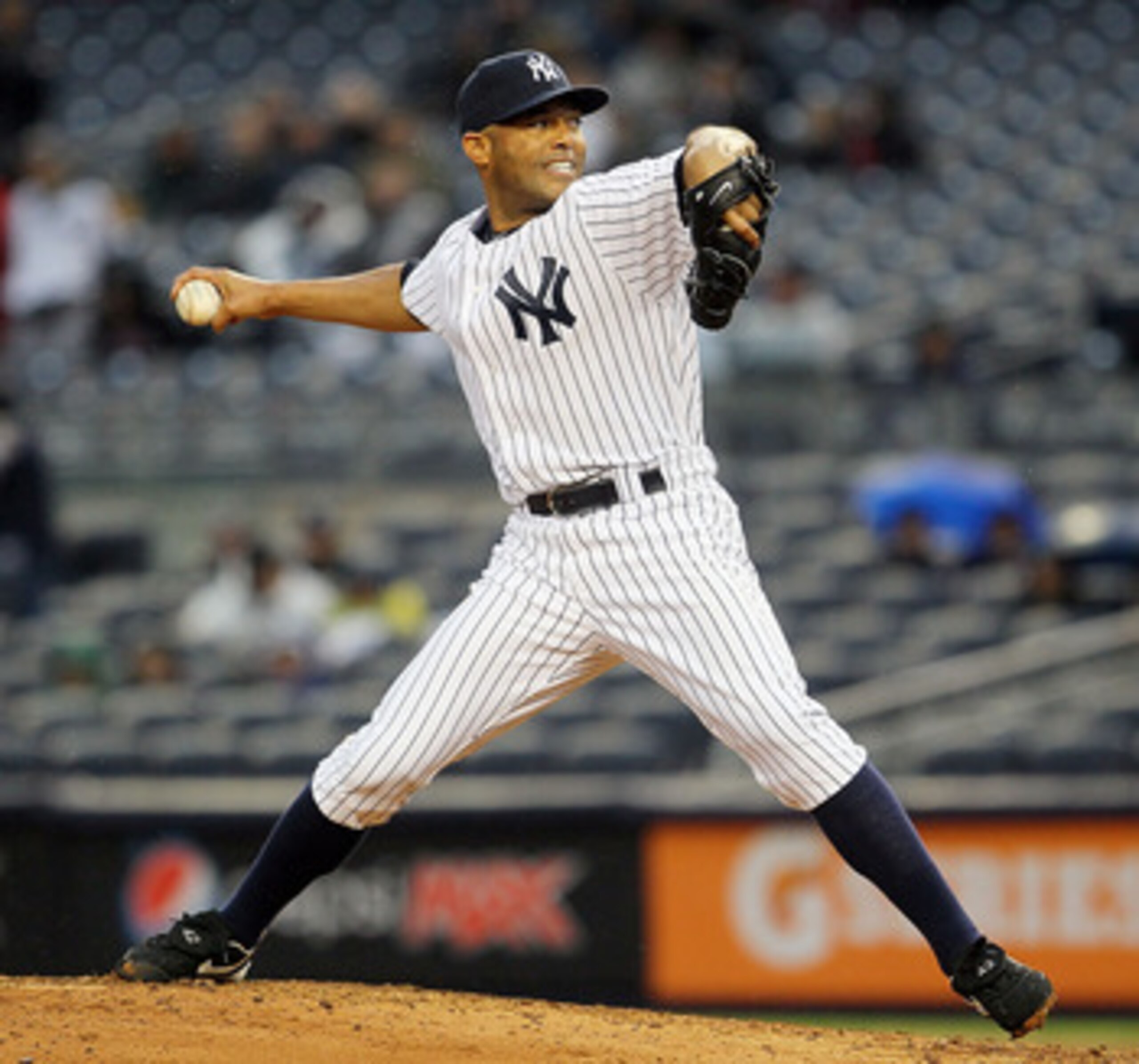 NEW YORK, NY - APRIL 16:  Mariano Rivera #42 of the New York Yankees delivers a ninth-inning pitch against the Texas Rangers on April 16, 2011 at Yankee Stadium in the Bronx borough of New York City. The Yankees defeated the Rangers 5-2.  (Photo by Jim Mc