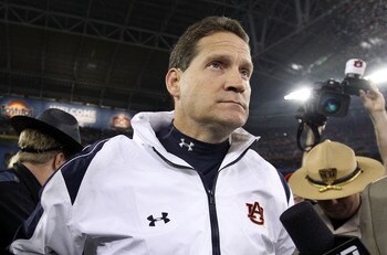 GLENDALE, AZ - JANUARY 10:  Head coach Gene Chizik of the Auburn Tigers celebrates the Tigers 22-19 victory against the Oregon Ducks during the Tostitos BCS National Championship Game at University of Phoenix Stadium on January 10, 2011 in Glendale, Arizo