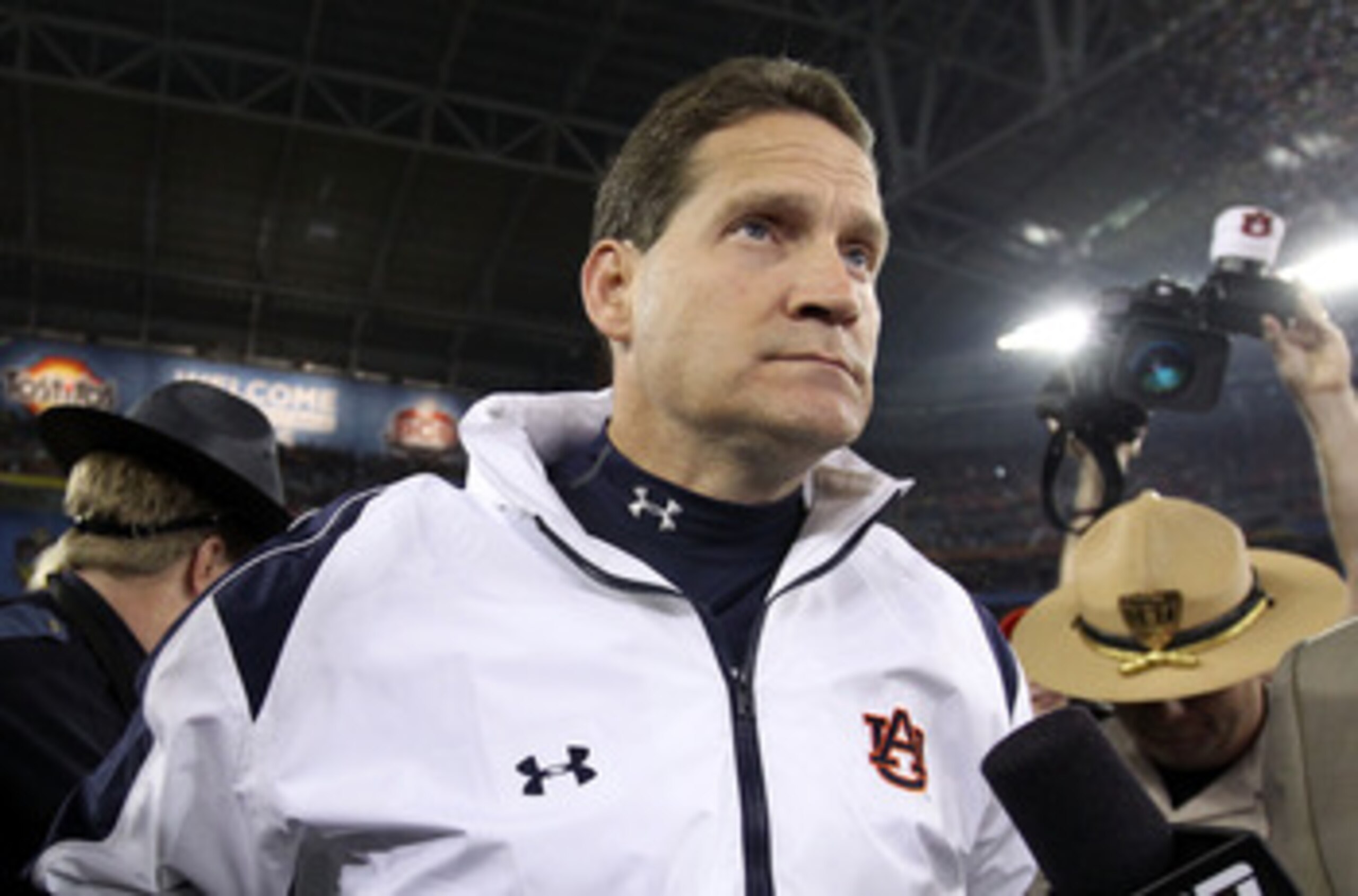 GLENDALE, AZ - JANUARY 10:  Head coach Gene Chizik of the Auburn Tigers celebrates the Tigers 22-19 victory against the Oregon Ducks during the Tostitos BCS National Championship Game at University of Phoenix Stadium on January 10, 2011 in Glendale, Arizo