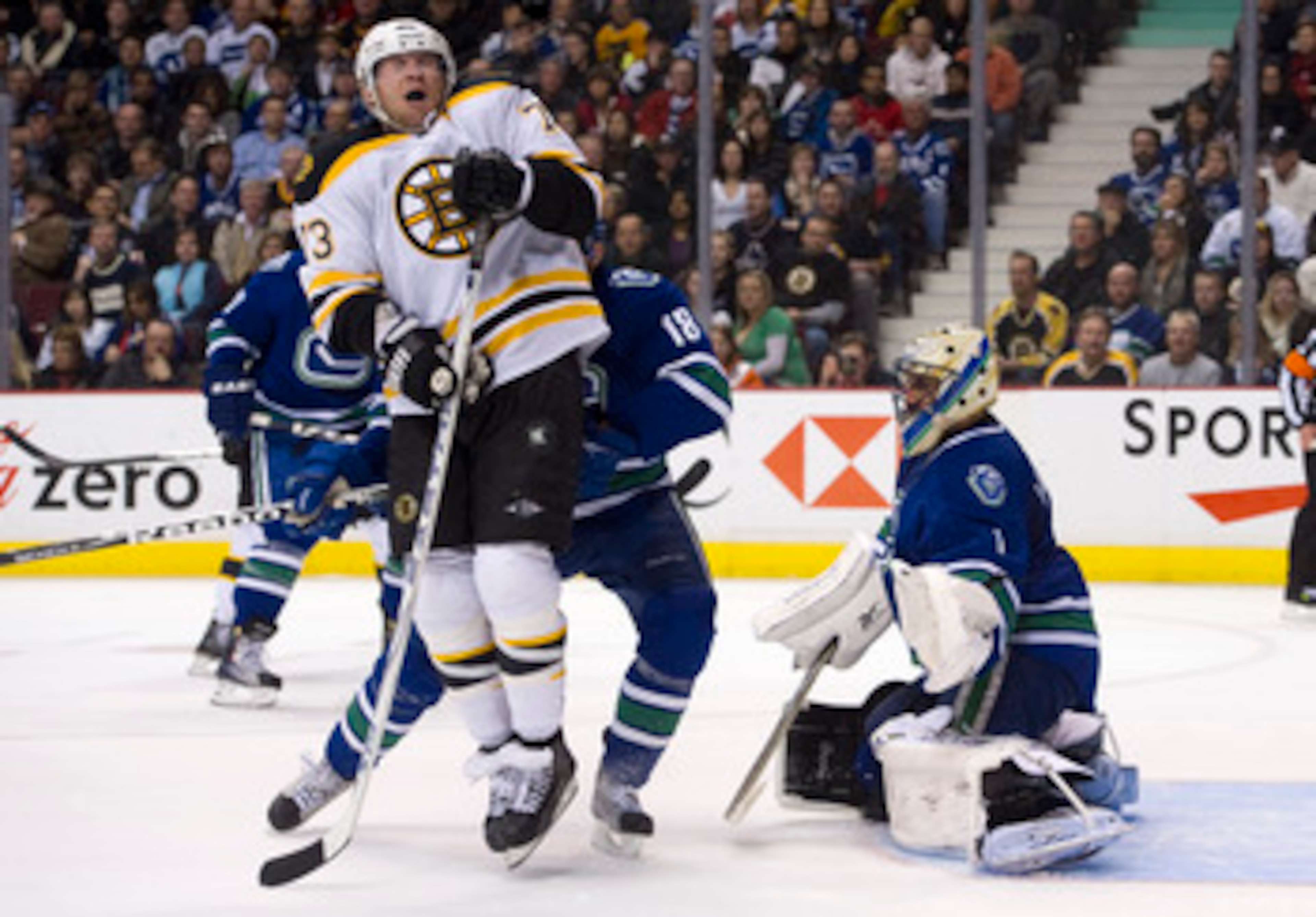 VANCOUVER, CANADA - FEBRUARY 26: Michael Ryder #73 of the Boston Bruins reacts after getting hit with the puck while standing in front of goalie Roberto Luongo #1 during the third period in NHL action on February 26, 2011 at Rogers Arena in Vancouver, Bri
