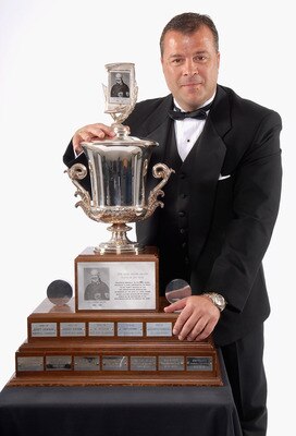 TORONTO, ON - JUNE 14:  Head coach Alain Vigneault  of the Vancouver Canucks poses with the Jack Adams Award for Coach of the Year during the 2007 NHL Awards at the Elgin Theatre on June 14, 2007 in Toronto, Ontario.  (Photo by Graig Abel/Getty Images for