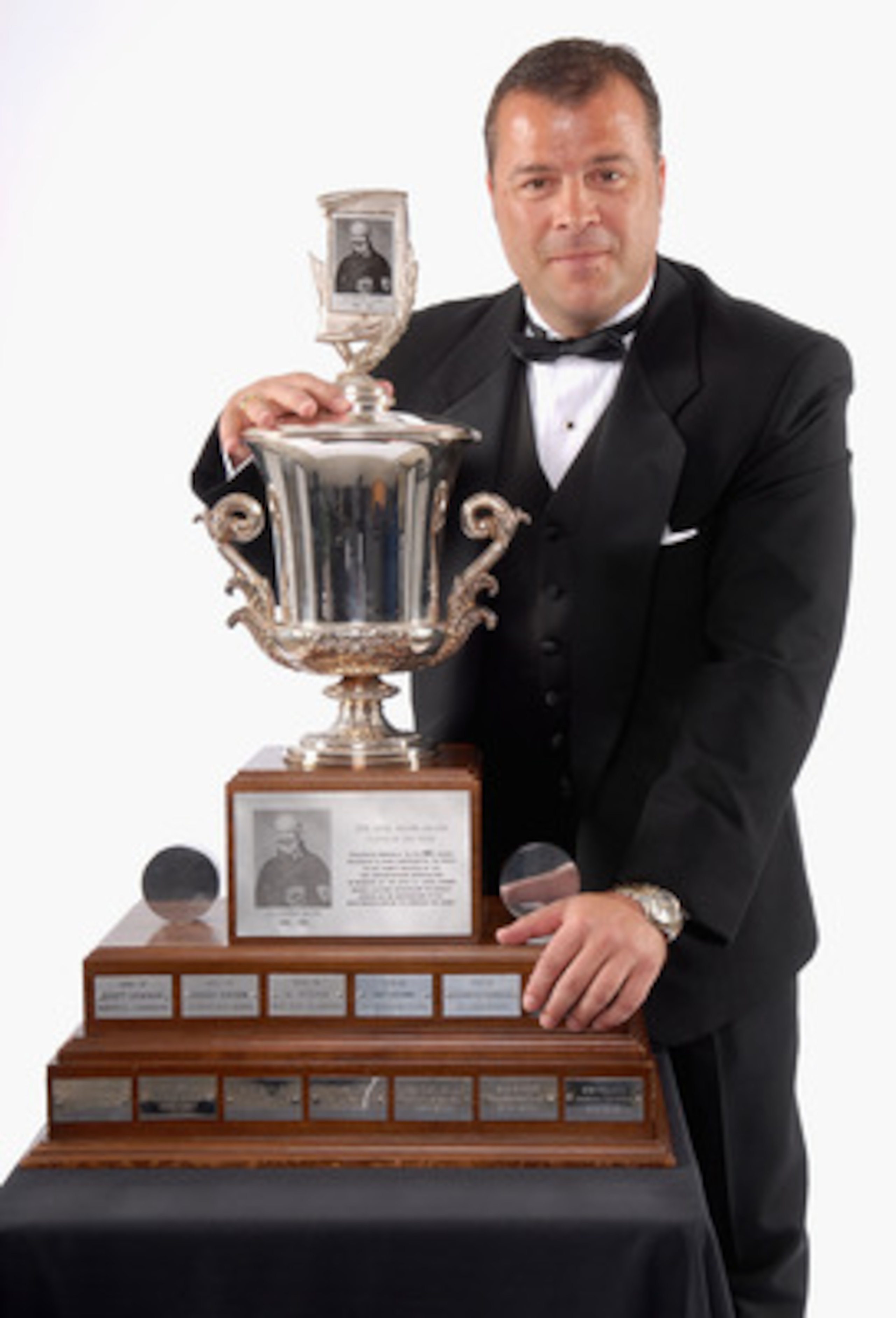 TORONTO, ON - JUNE 14:  Head coach Alain Vigneault  of the Vancouver Canucks poses with the Jack Adams Award for Coach of the Year during the 2007 NHL Awards at the Elgin Theatre on June 14, 2007 in Toronto, Ontario.  (Photo by Graig Abel/Getty Images for
