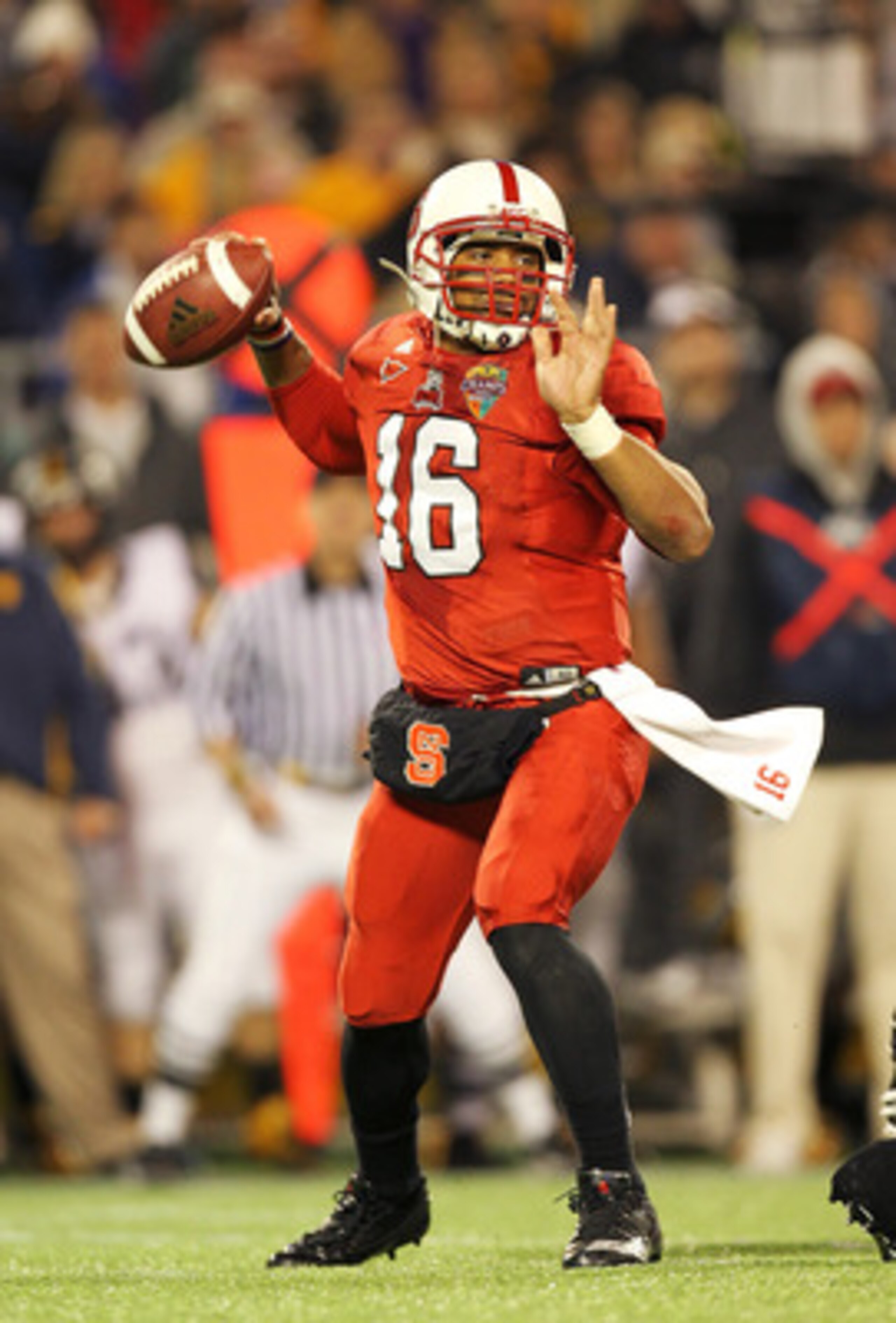 ORLANDO, FL - DECEMBER 28:  Russell Wilson #16 of the North Carolina State Wolfpack passes the ball during the Champs Sports Bowl against the West Virginia Mountineers at Florida Citrus Bowl Stadium on December 28, 2010 in Orlando, Florida.  (Photo by Mik