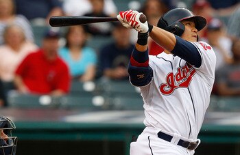 CLEVELAND - MAY 13: Shin-Soo Choo #17 of the Cleveland Indians hits a solo home run against the Seattle Mariners during the game on May 13, 2011 at Progressive Field in Cleveland, Ohio.  (Photo by Jared Wickerham/Getty Images)