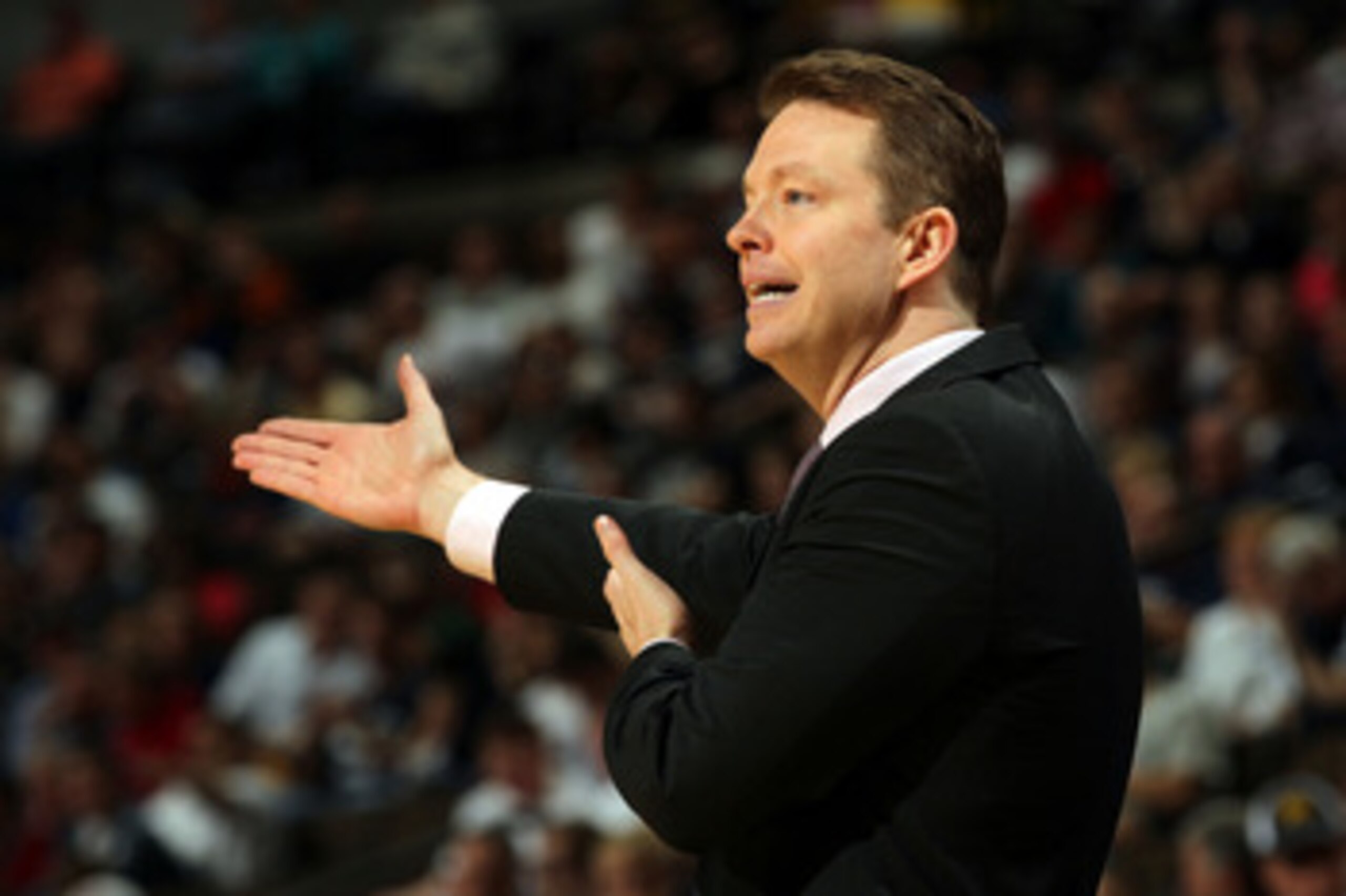 DENVER, CO - MARCH 19:  Head coach Chris Mooney of the Richmond Spiders gestures fromo the sidelines against the Morehead State Eagles during the third round of the 2011 NCAA men's basketball tournament at Pepsi Center on March 19, 2011 in Denver, Colorad