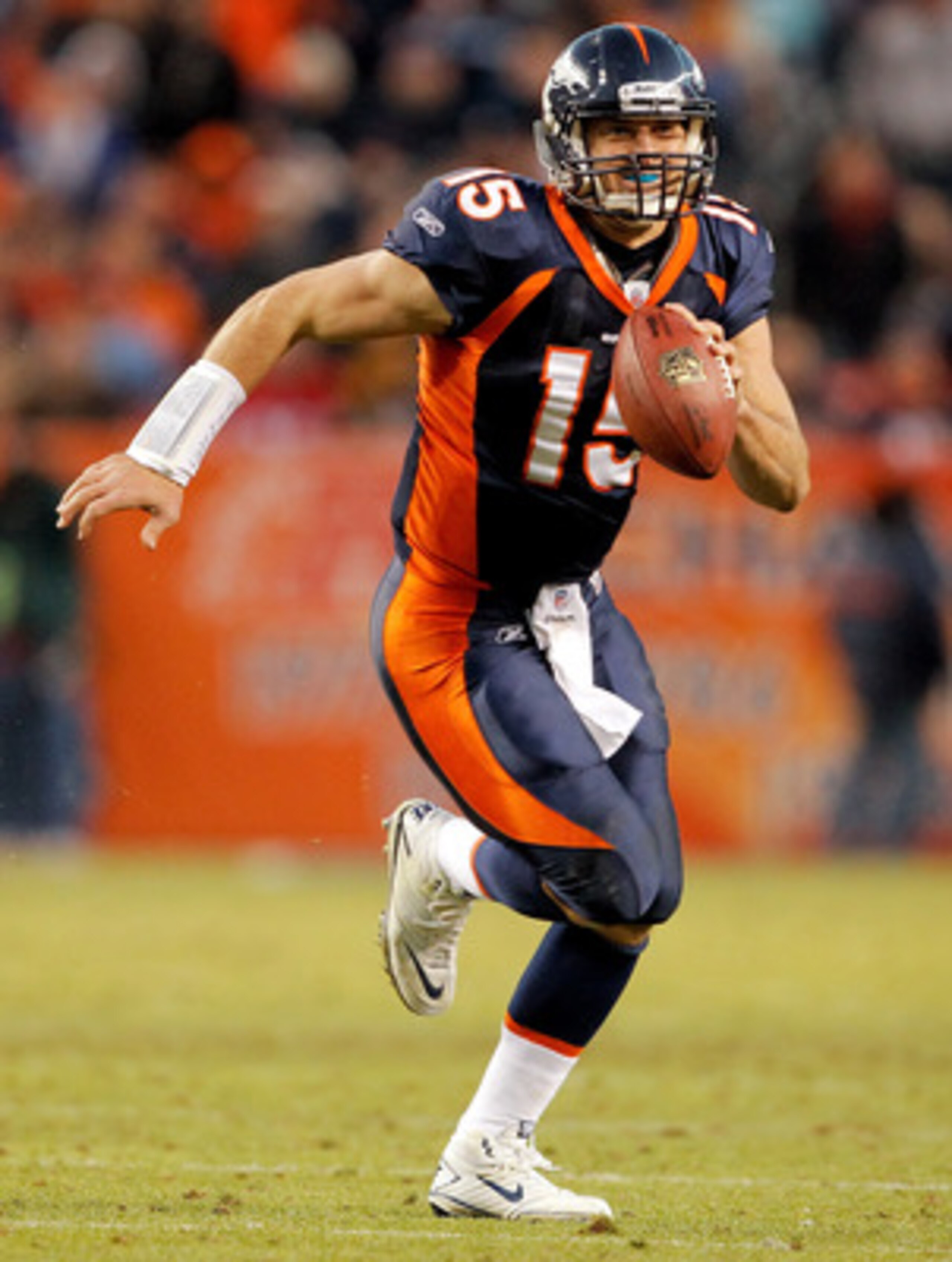 DENVER - DECEMBER 26:  Quarterback Tim Tebow #15 of the Denver Broncos runs against the Houston Texans during the fourth quarter at INVESCO Field at Mile High on December 26, 2010 in Denver, Colorado.  The Denver Broncos defeated the Houston Texans 24-23.