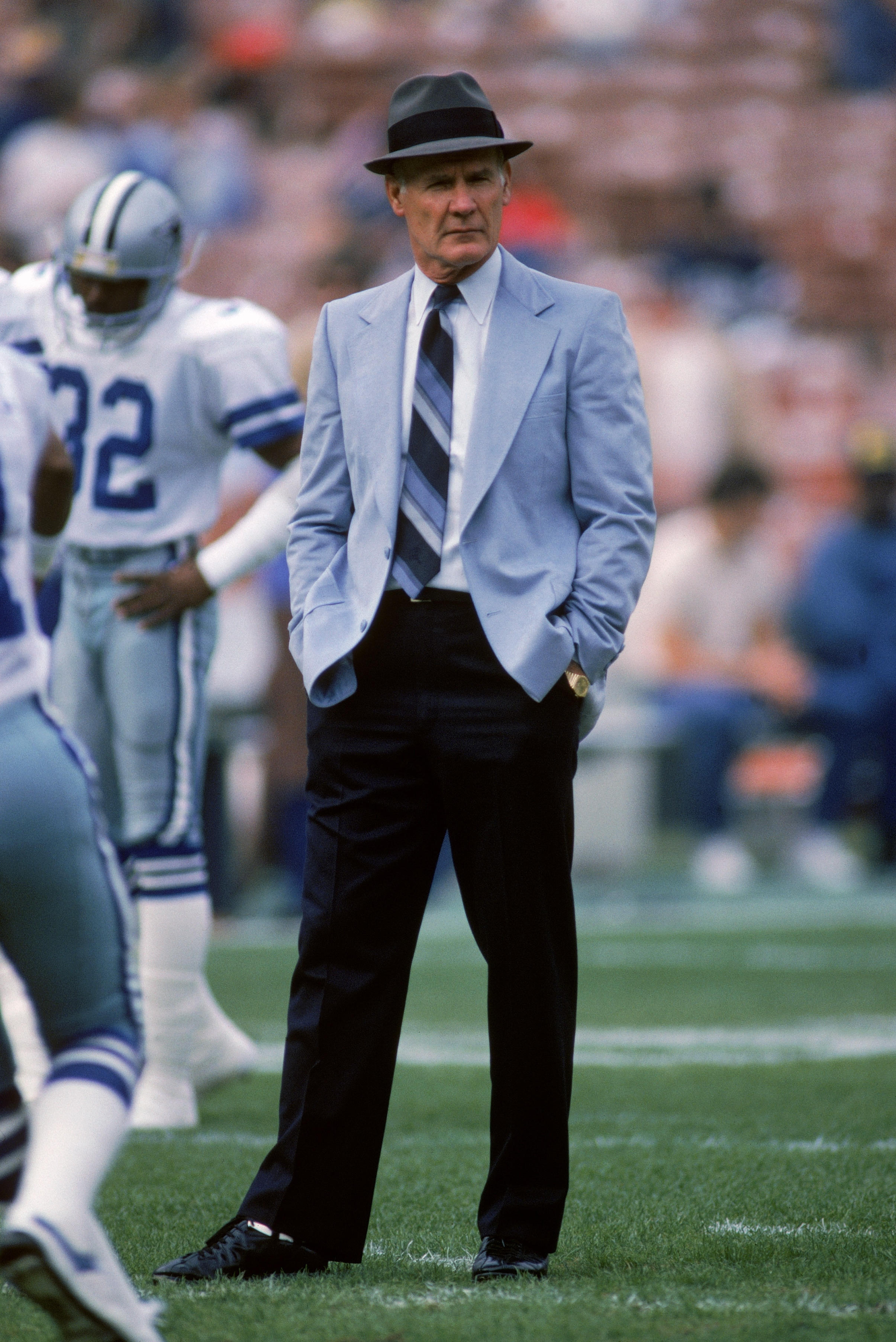 1986:  Head coach Tom Landry of the Dallas Cowboys walks on the field during the 1987 season.  Tom Landry coached the Cowboys from 1960 to 1988, leading them to two Super Bowl victories.  (Photo by Stephen Dunn/Getty Images)