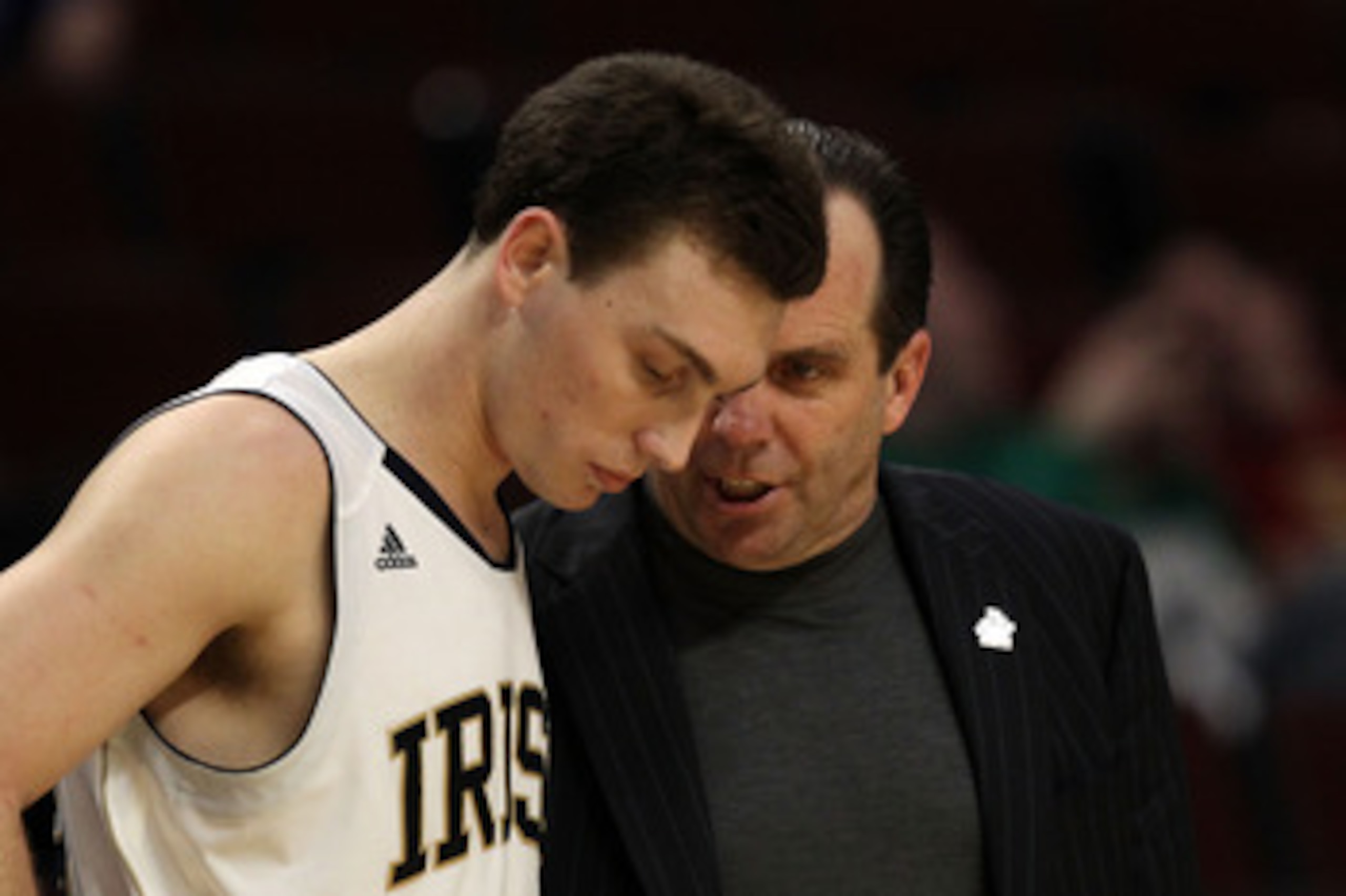 CHICAGO, IL - MARCH 20: Ben Hansbrough #23 of the Notre Dame Fighting Irish talks with head coach Mike Brey in the second half during the third round of the 2011 NCAA men's basketball tournament at the United Center on March 20, 2011 in Chicago, Illinois.