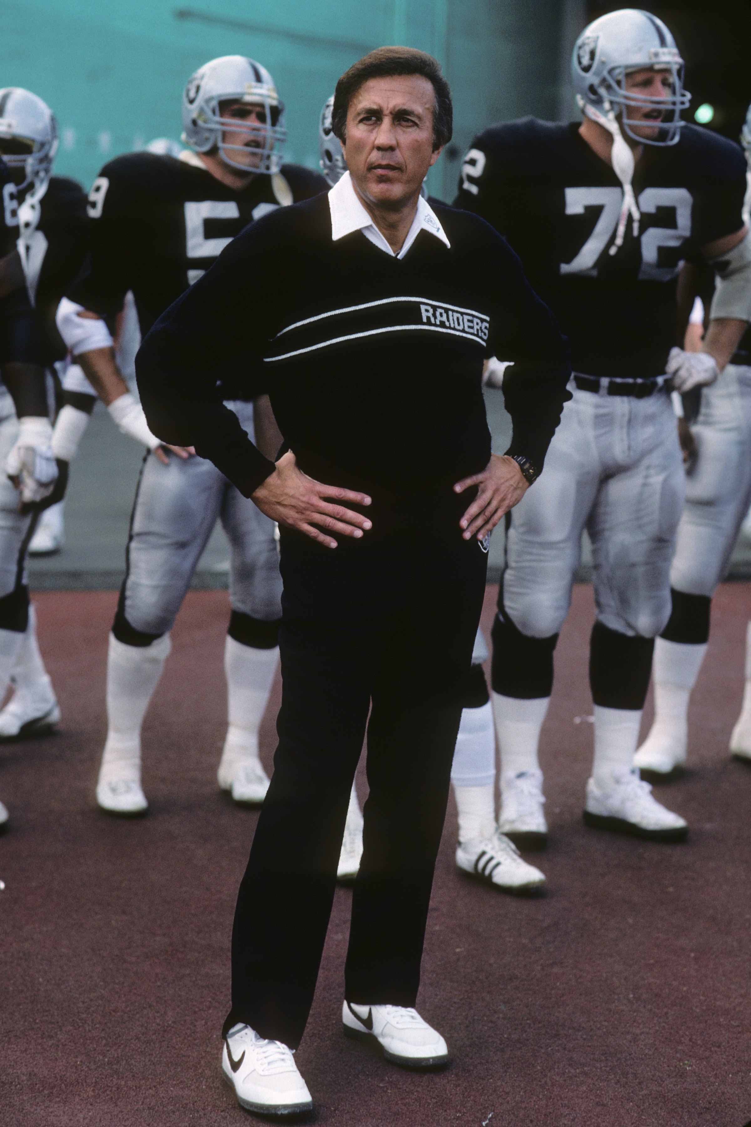 LOS ANGELES - DECEMBER 6:  Head coach Tom Flores and his Los Angeles Raiders wait for team introductions to run onto the field prior to the game against the Buffalo Bills at the Los Angeles Memorial Coliseum on December 6, 1987 in Los Angeles, California.
