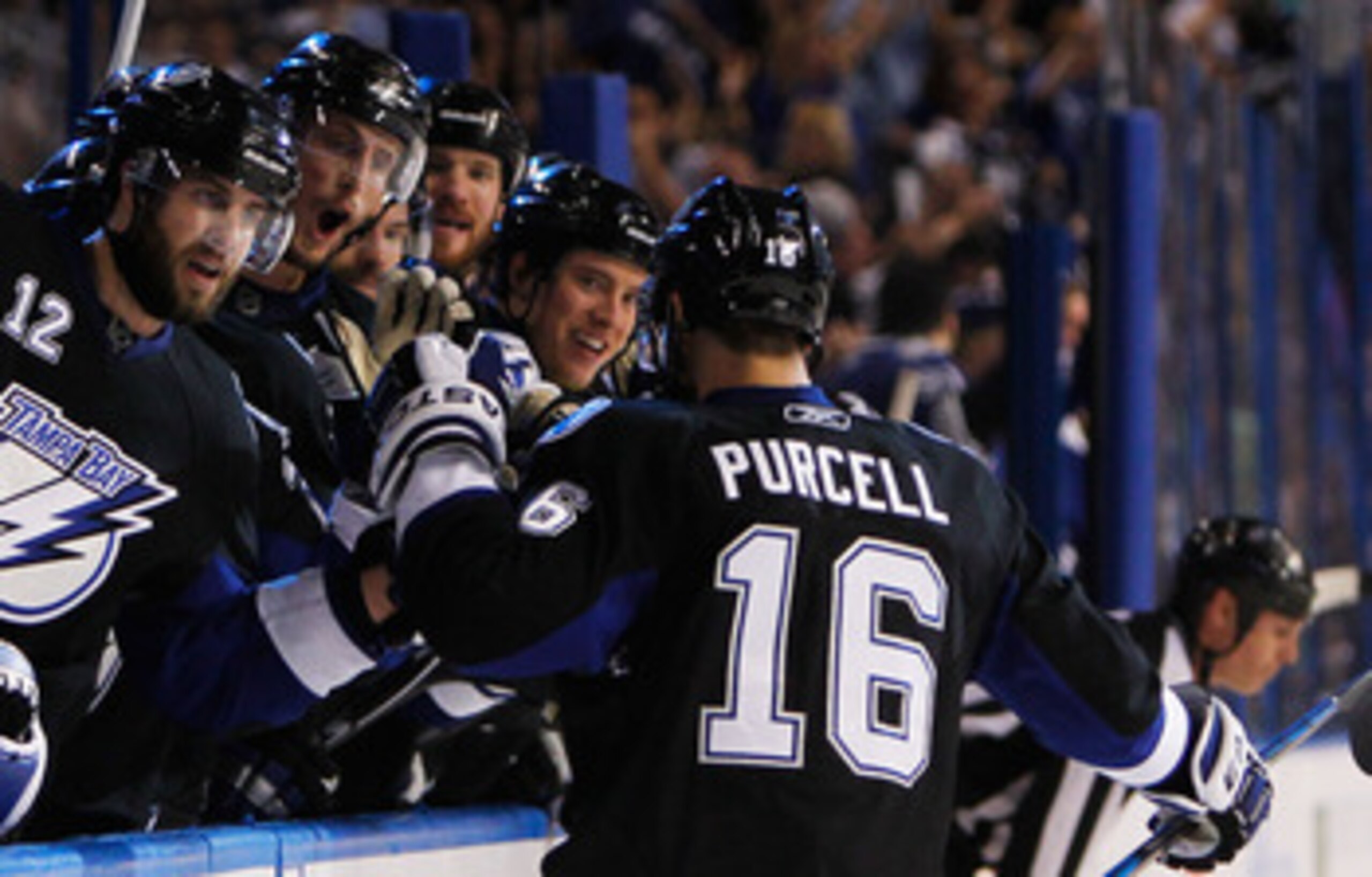 TAMPA, FL - MAY 25: Teddy Purcell #16 of the Tampa Bay Lightning celebrates his second period goal with teammates in Game Six of the Eastern Conference Finals against the Boston Bruins during the 2011 NHL Stanley Cup Playoffs at St Pete Times Forum on Ma TAMPA, FL - MAY 25: Teddy Purcell #16 of the Tampa Bay Lightning celebrates his second period goal with teammates in Game Six of the Eastern Conference Finals against the Boston Bruins during the 2011 NHL Stanley Cup Playoffs at St Pete Times Forum on Ma