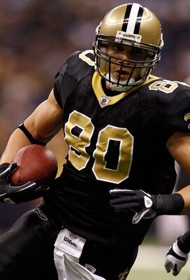 NEW ORLEANS, LA - JANUARY 02:  Jimmy Graham #80 of the New Orleans Saints is tackled by Barrett Ruud #51 of the Tampa Bay Buccaneers at the Louisiana Superdome on January 2, 2011 in New Orleans, Louisiana.  (Photo by Chris Graythen/Getty Images)