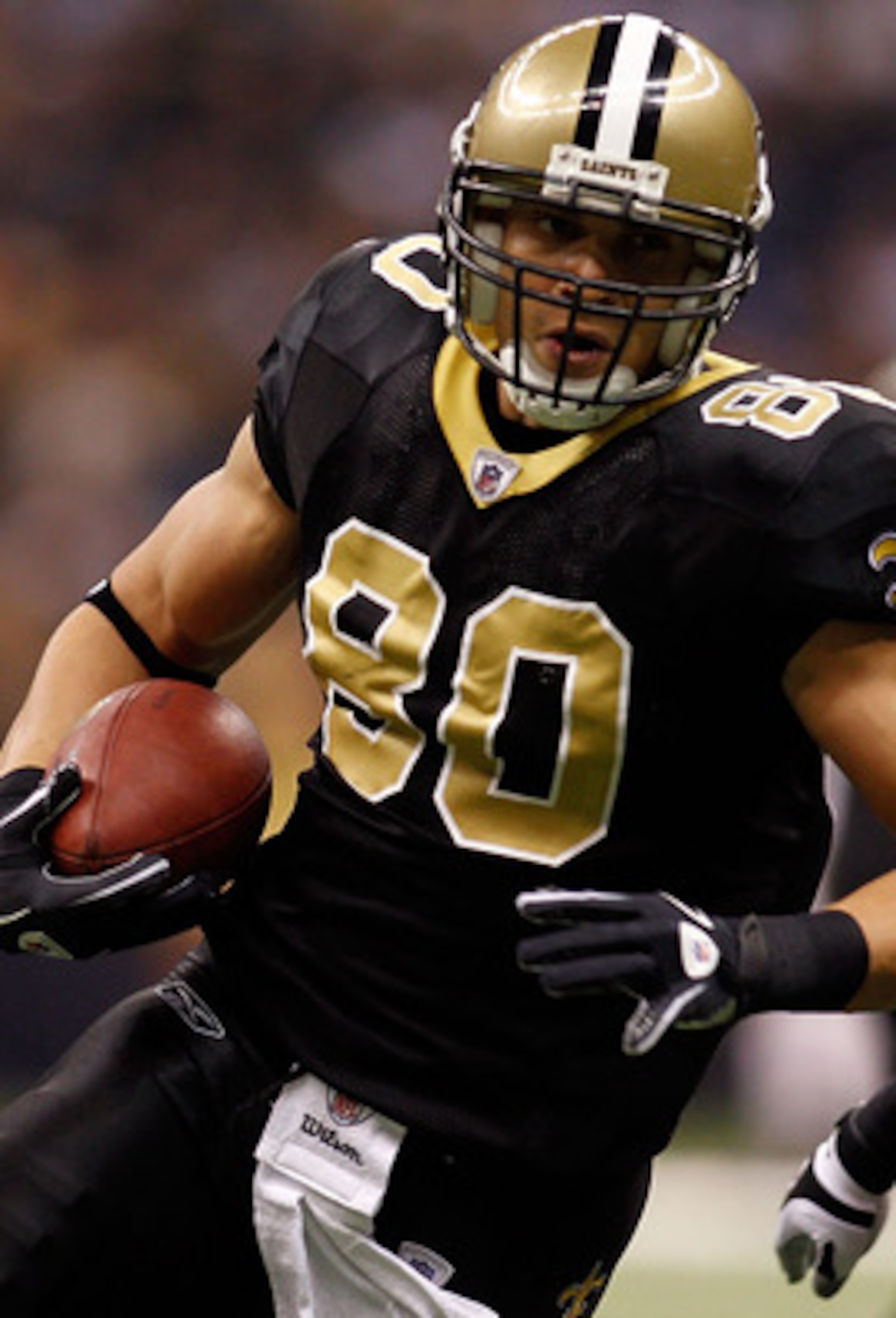 NEW ORLEANS, LA - JANUARY 02:  Jimmy Graham #80 of the New Orleans Saints is tackled by Barrett Ruud #51 of the Tampa Bay Buccaneers at the Louisiana Superdome on January 2, 2011 in New Orleans, Louisiana.  (Photo by Chris Graythen/Getty Images)