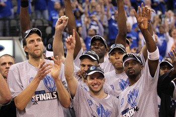 DALLAS, TX - MAY 25:  Dirk Nowitzki #41, Jose Juan Barea #11 and Jason Terry #31 and the Dallas Mavericks celebrate their 100-96 victory against the Oklahoma City Thunder in Game Five of the Western Conference Finals during the 2011 NBA Playoffs at Americ