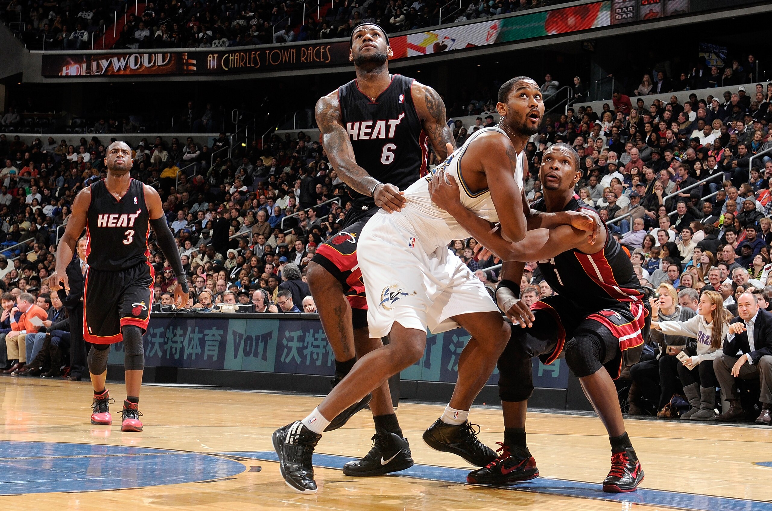 WASHINGTON, DC - DECEMBER 18:  LeBron James #6, Dwyane Wade #3 and Chris Bosh #1 of the Miami Heat and Hilton Armstrong #24 of the Washington Wizards box out after a free throw attempt at the Verizon Center on December 18, 2010 in Washington, DC. NOTE TO 