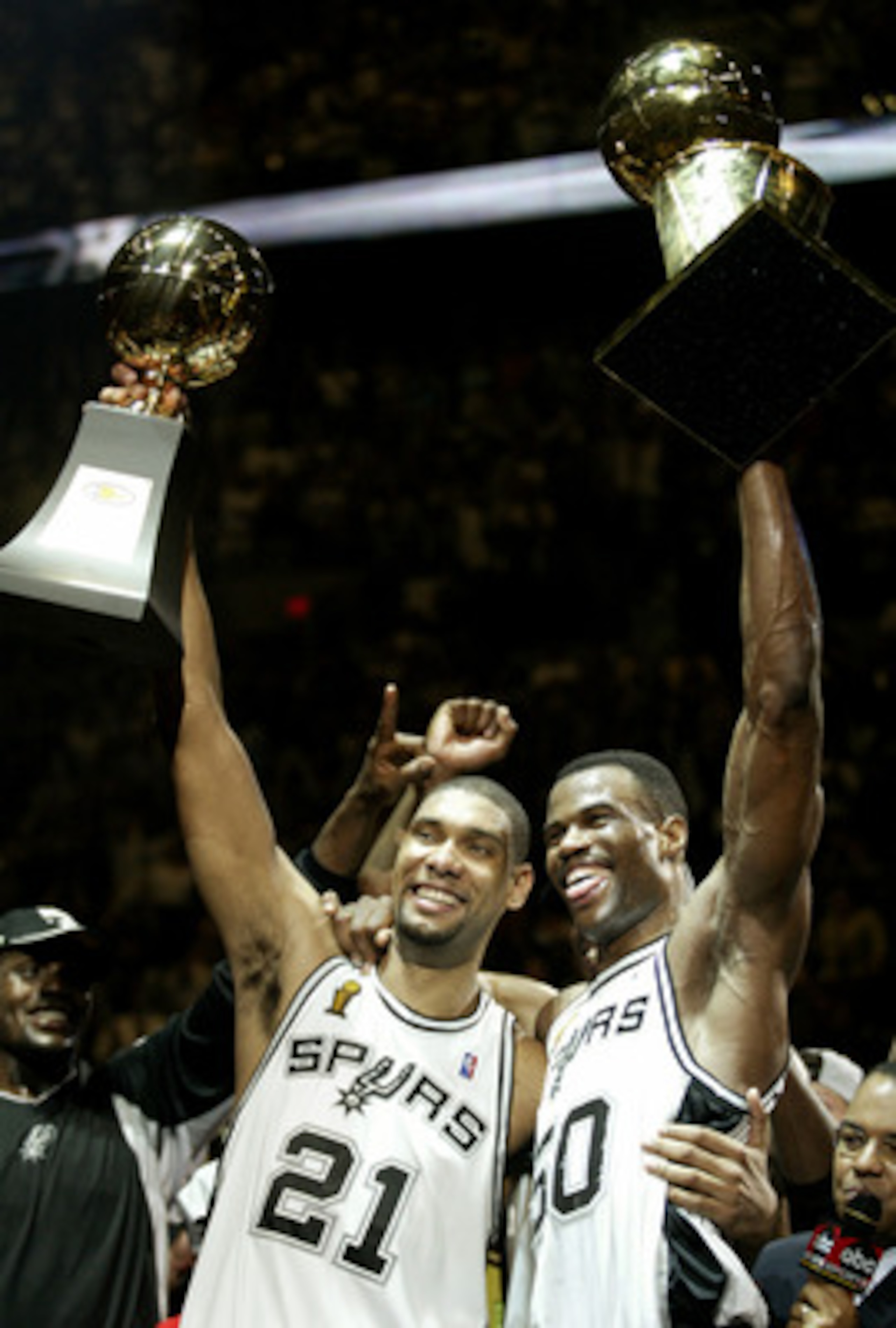 SAN ANTONIO, TX - JUNE 15:  Tim Duncan #21 and David Robinson #50 of the San Antonio Spurs celebrate after winning Game six of the 2003 NBA Finals against the New Jersey Nets on June 15, 2003 at the SBC Center in San Antonio, Texas.  The Spurs won 88-77 a