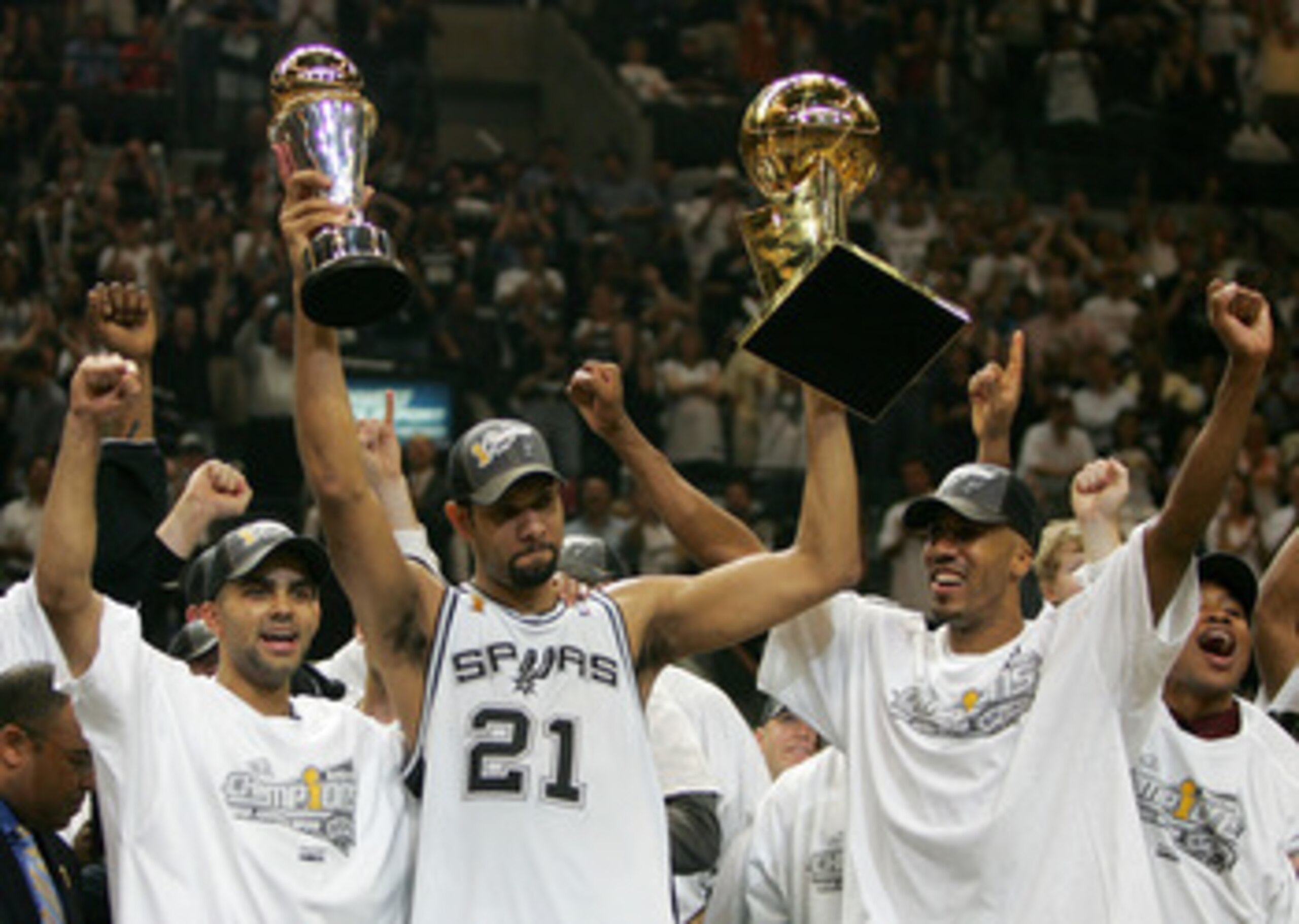 SAN ANTONIO - JUNE 23:  Tim Duncan #21 of the San Antonio Spurs celebrates with the Finals MVP Trophy and the Larry O'Brien Trophy after defeating the Detroit Pistons in Game seven of the 2005 NBA Finals at SBC Center on June 23, 2005 in San Antonio, Texa