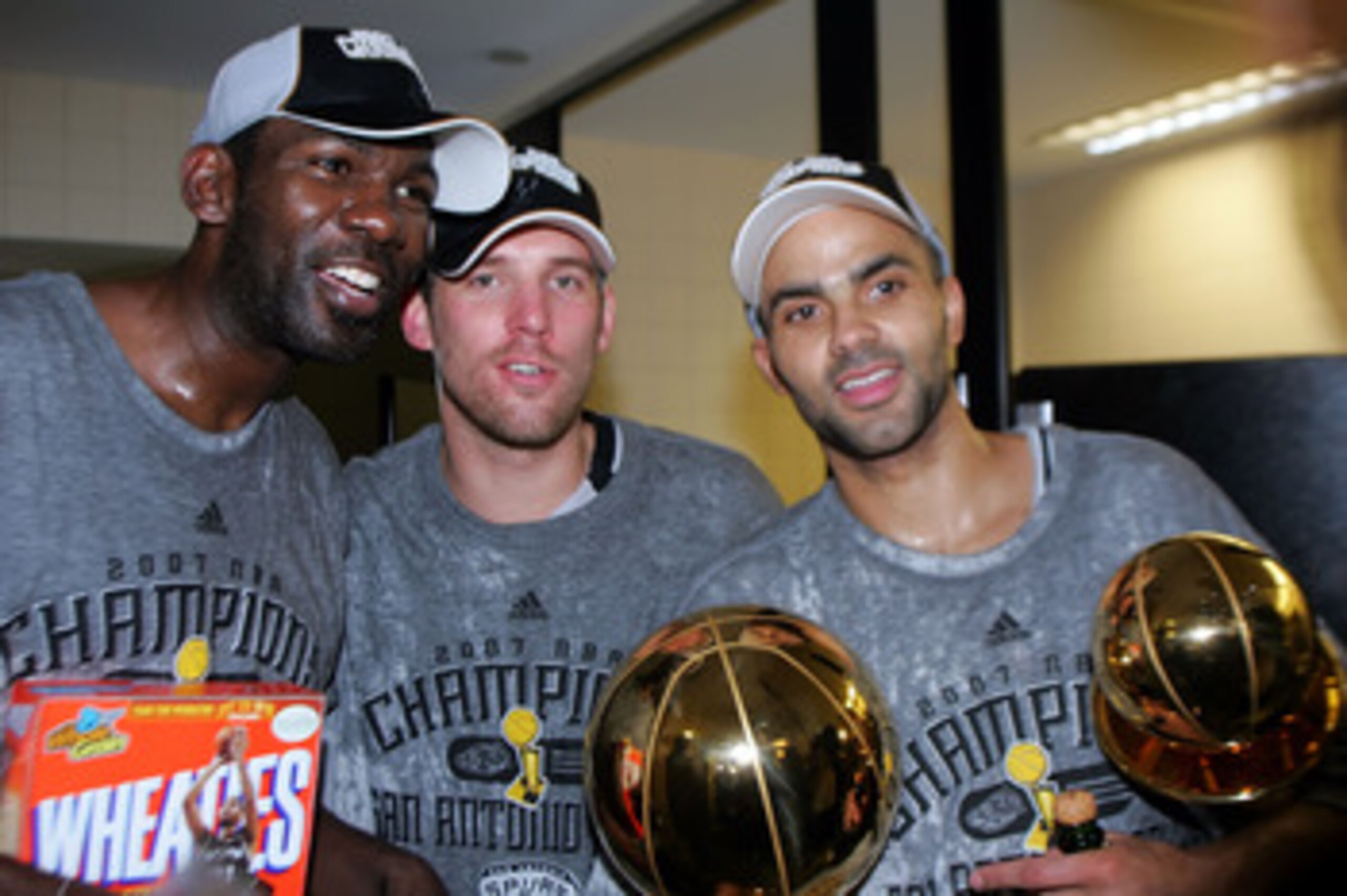 CLEVELAND - JUNE 14:  Tony Parker #9 and Head Coach Gregg Popovich of the San Antonio Spurs celebrates after the win in Game Four of the NBA Finals on June 14, 2007 at the Quicken Loans Arena in Cleveland, Ohio. NOTE TO USER: User expressly acknowledges a