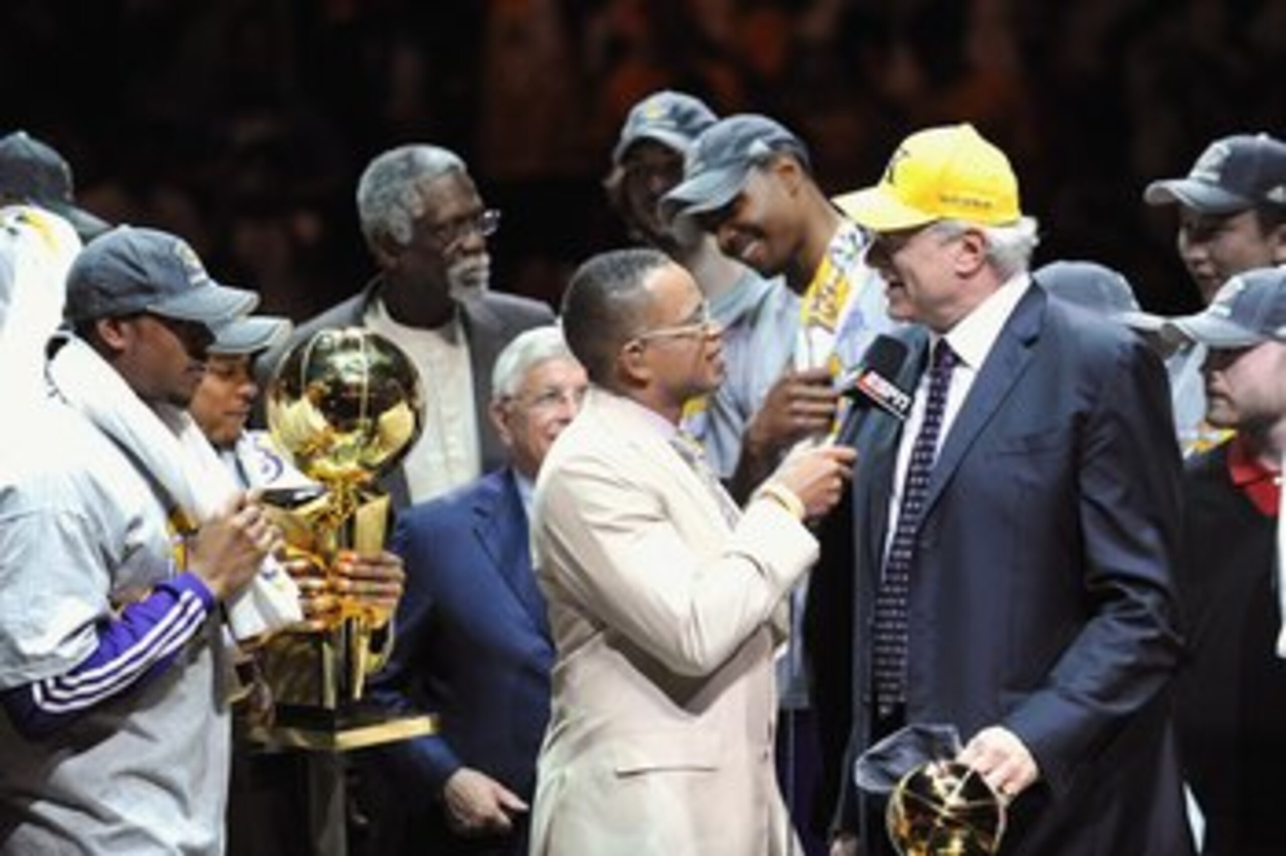 ORLANDO, FL - JUNE 14:  Kobe Bryant #24 of the Los Angeles Lakers holds the Bill Russell MVP trophy and the Larry O'Brien trophy after defeating the Orlando Magic in Game Five of the 2009 NBA Finals on June 14, 2009 at Amway Arena in Orlando, Florida. The