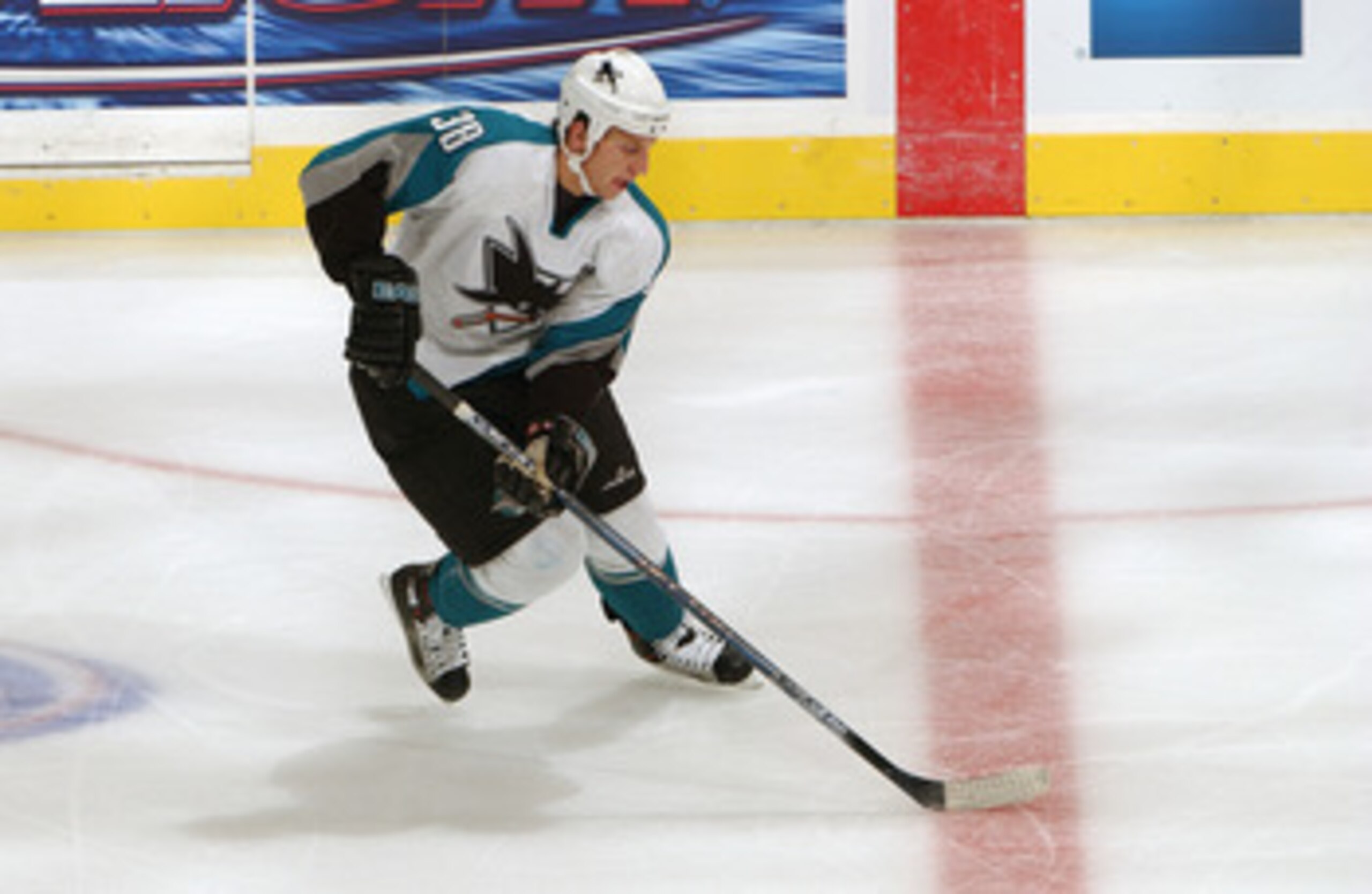 LOS ANGELES - SEPTEMBER 27: Ryan Clowe #38 of the San Jose Sharks skates with the puck during a game against the Los Angeles Kings at the Staples Center on September 27, 2005 in Los Angeles, California. The Sharks won 5-3. (Photo by Noah Graham/Getty I LOS ANGELES - SEPTEMBER 27: Ryan Clowe #38 of the San Jose Sharks skates with the puck during a game against the Los Angeles Kings at the Staples Center on September 27, 2005 in Los Angeles, California. The Sharks won 5-3. (Photo by Noah Graham/Getty I