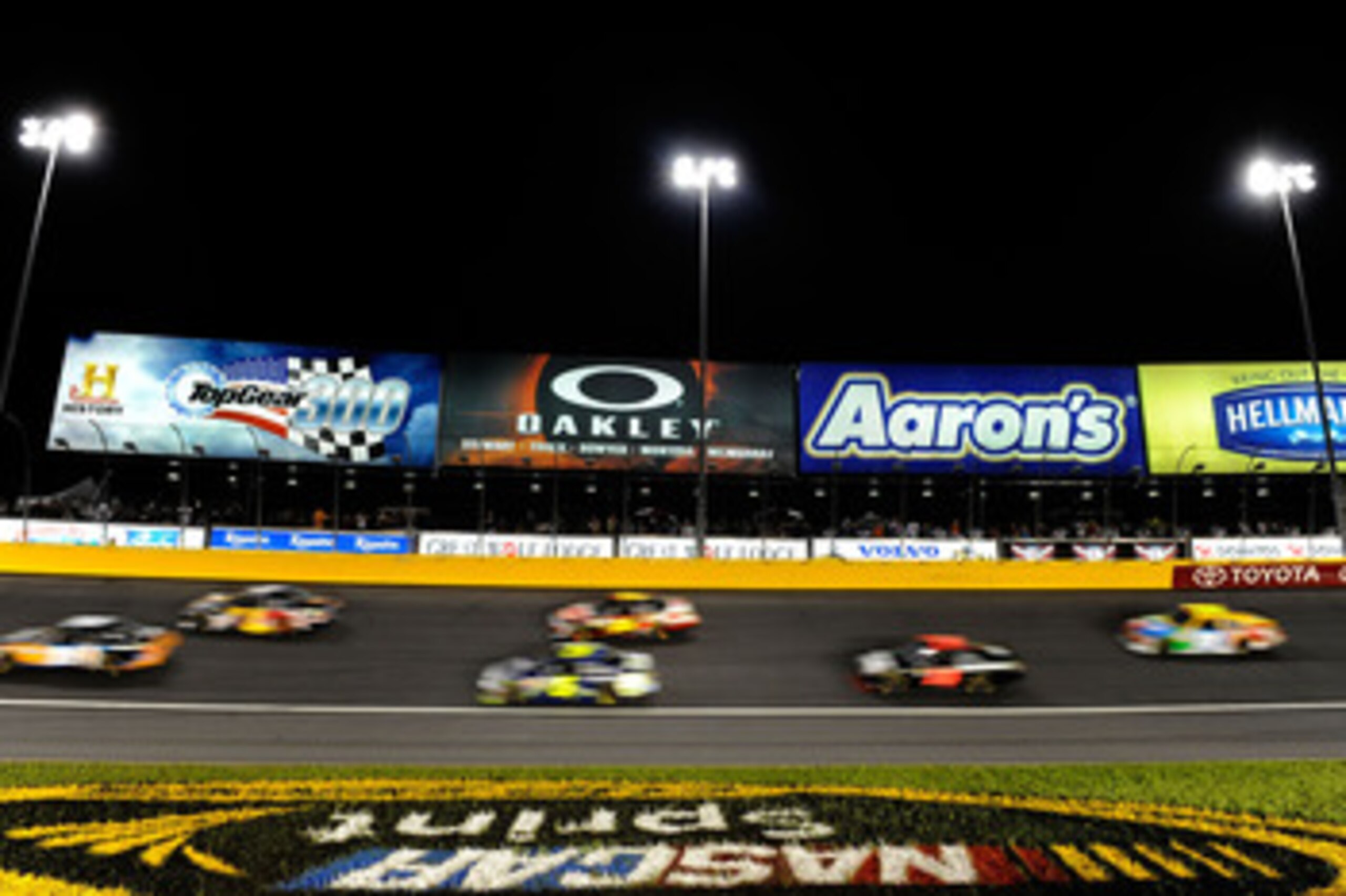 CHARLOTTE, NC - MAY 21:  A view of cars racing during the NASCAR Sprint All-Star Race at Charlotte Motor Speedway on May 21, 2011 in Charlotte, North Carolina.  (Photo by John Harrelson/Getty Images for NASCAR)