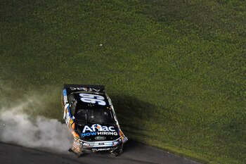 CHARLOTTE, NC - MAY 21: Carl Edwards, driver of the #99 Aflac Ford, crashes his car while celebrating, after winning the NASCAR Sprint All-Star Race at Charlotte Motor Speedway on May 21, 2011 in Charlotte, North Carolina.  (Photo by Drew Hallowell/Getty 