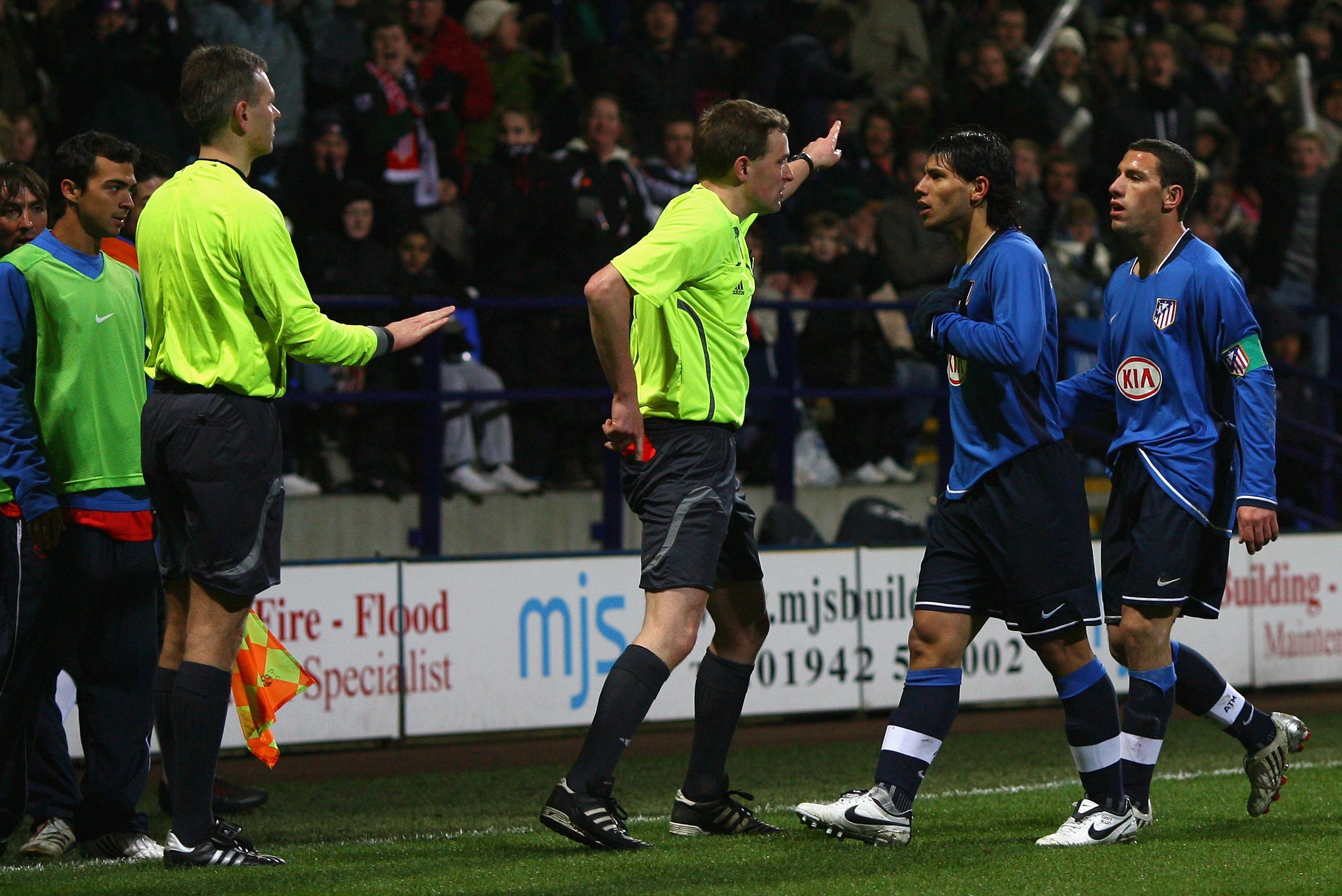 BOLTON, UNITED KINGDOM - FEBRUARY 14: Referee N Vollquartz shows a red card to Sergio Aguero of Atletico Madrid during the UEFA Cup Round of 32, First Leg match between Bolton Wanderers and Atletico Madrid at The Reebok Stadium on February 14, 2008 in Bol