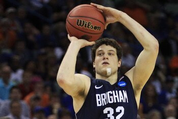 NEW ORLEANS, LA - MARCH 24:  Jimmer Fredette #32 of the Brigham Young Cougars shoots over Scottie Wilbekin #5 of the Florida Gators in the second half during the Southeast regional of the 2011 NCAA men's basketball tournament at New Orleans Arena on March