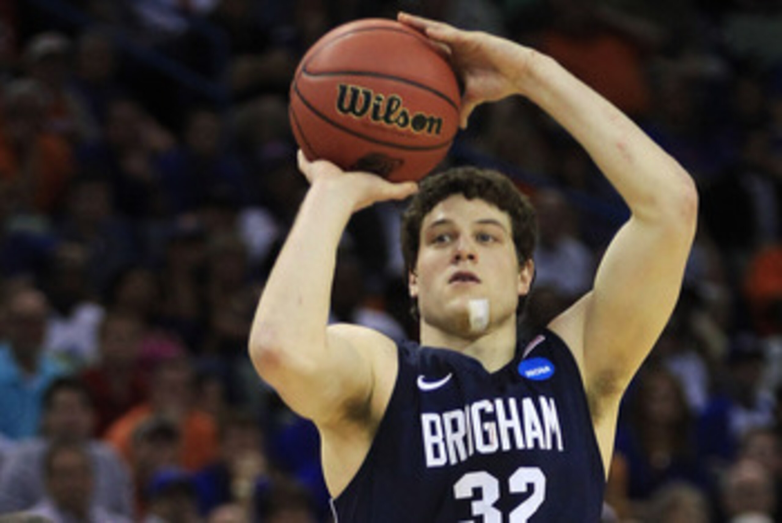 NEW ORLEANS, LA - MARCH 24:  Jimmer Fredette #32 of the Brigham Young Cougars shoots over Scottie Wilbekin #5 of the Florida Gators in the second half during the Southeast regional of the 2011 NCAA men's basketball tournament at New Orleans Arena on March