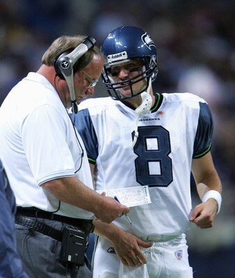 ST. LOUIS - OCTOBER 9:  Matt Hasselbeck #8 talsk with Head Coach Mike Holmgren of the Seattle Seahawks during the game with the St. Louis Rams on October 9,2005 at the Edward Jones Dome  in St. Louis, Missouri. The Seahawks won 37-31. (Photo by Elsa/Getty