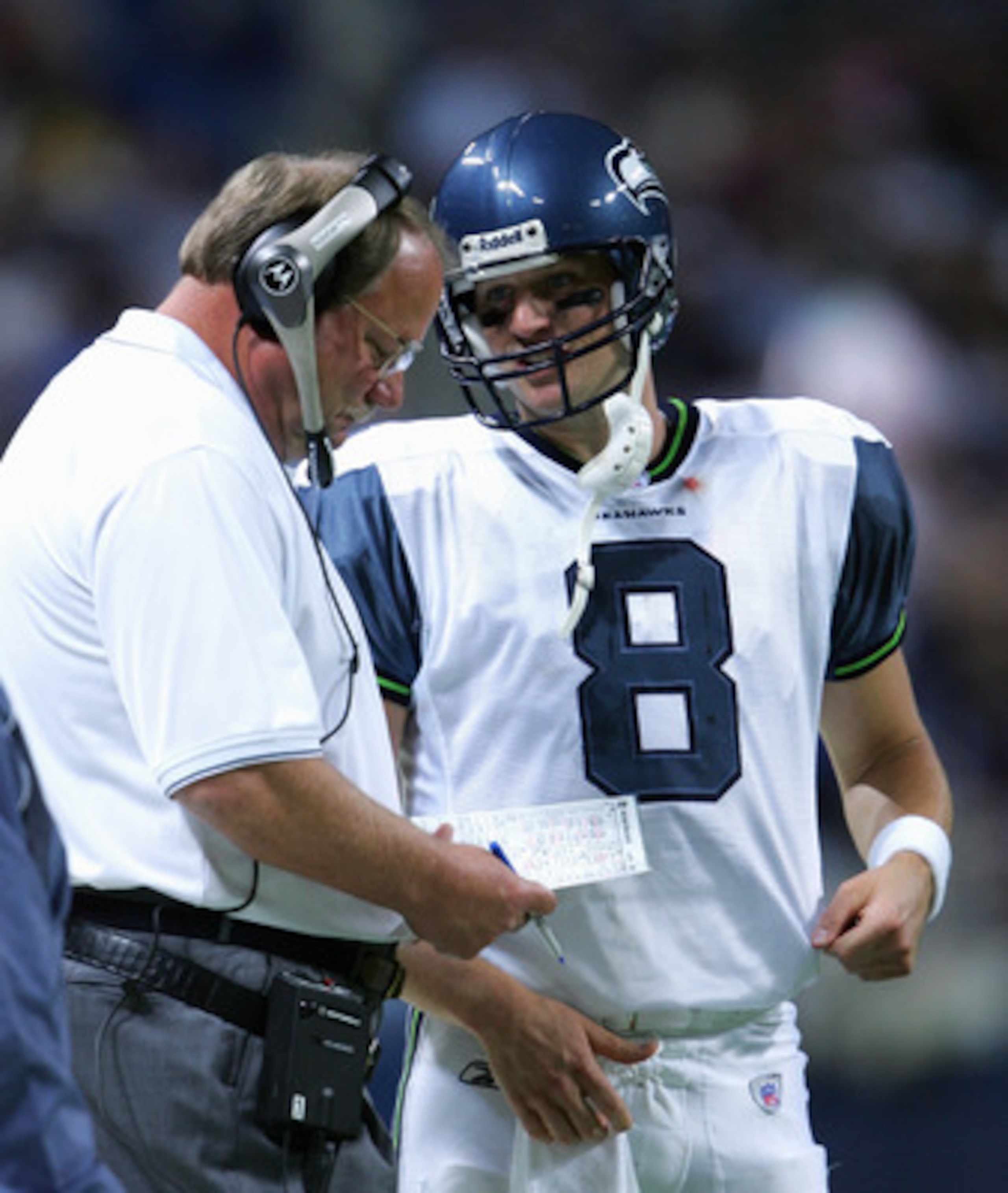 ST. LOUIS - OCTOBER 9:  Matt Hasselbeck #8 talsk with Head Coach Mike Holmgren of the Seattle Seahawks during the game with the St. Louis Rams on October 9,2005 at the Edward Jones Dome  in St. Louis, Missouri. The Seahawks won 37-31. (Photo by Elsa/Getty