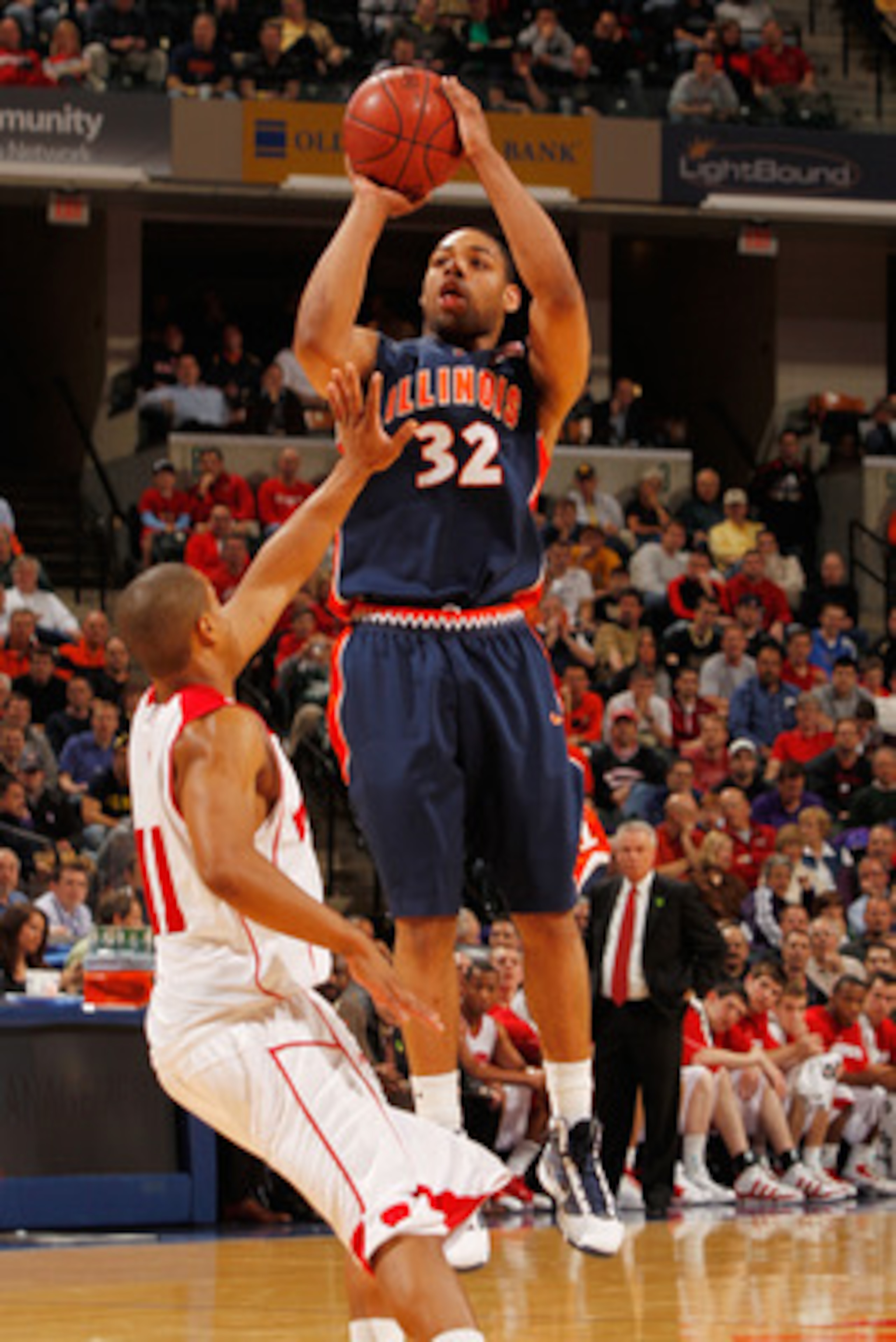 INDIANAPOLIS - MARCH 12:  Guard Demetri McCamey #32 of the Illinois Fighting Illini attempts a shot against the Wisconsin Badgers during the quarterfinals of the Big Ten Men's Basketball Tournament at Conseco Fieldhouse on March 12, 2010 in Indianapolis, 