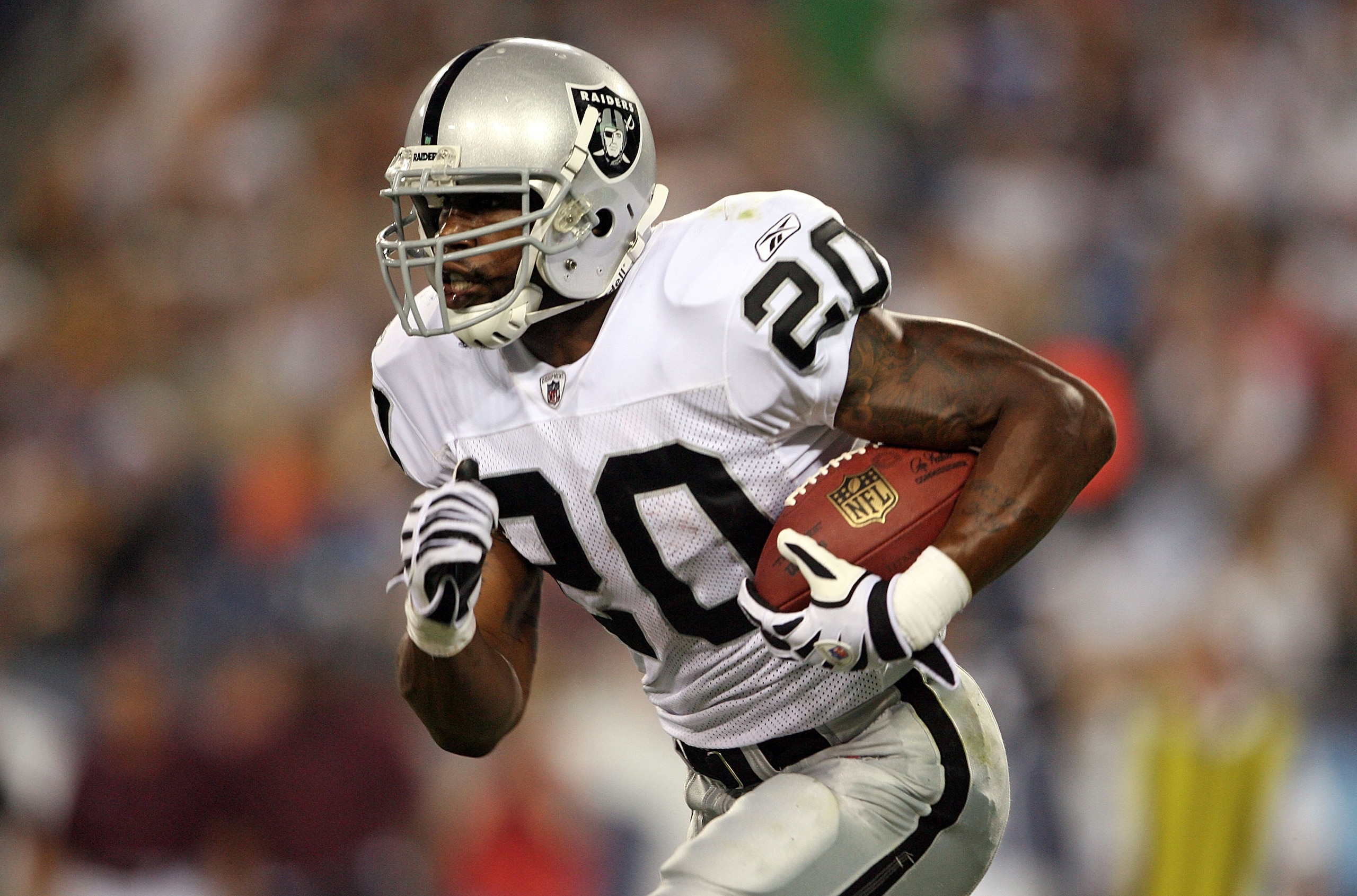 NASHVILLE, TN - AUGUST 15: Darren McFadden #20 of the Oakland Raiders runs with the ball during the NFL pre-season game against the Tennessee Titans at LP Field August 15, 2008 in Nashville, Tennessee. (Photo by Andy Lyons/Getty Images) NASHVILLE, TN - AUGUST 15: Darren McFadden #20 of the Oakland Raiders runs with the ball during the NFL pre-season game against the Tennessee Titans at LP Field August 15, 2008 in Nashville, Tennessee. (Photo by Andy Lyons/Getty Images)