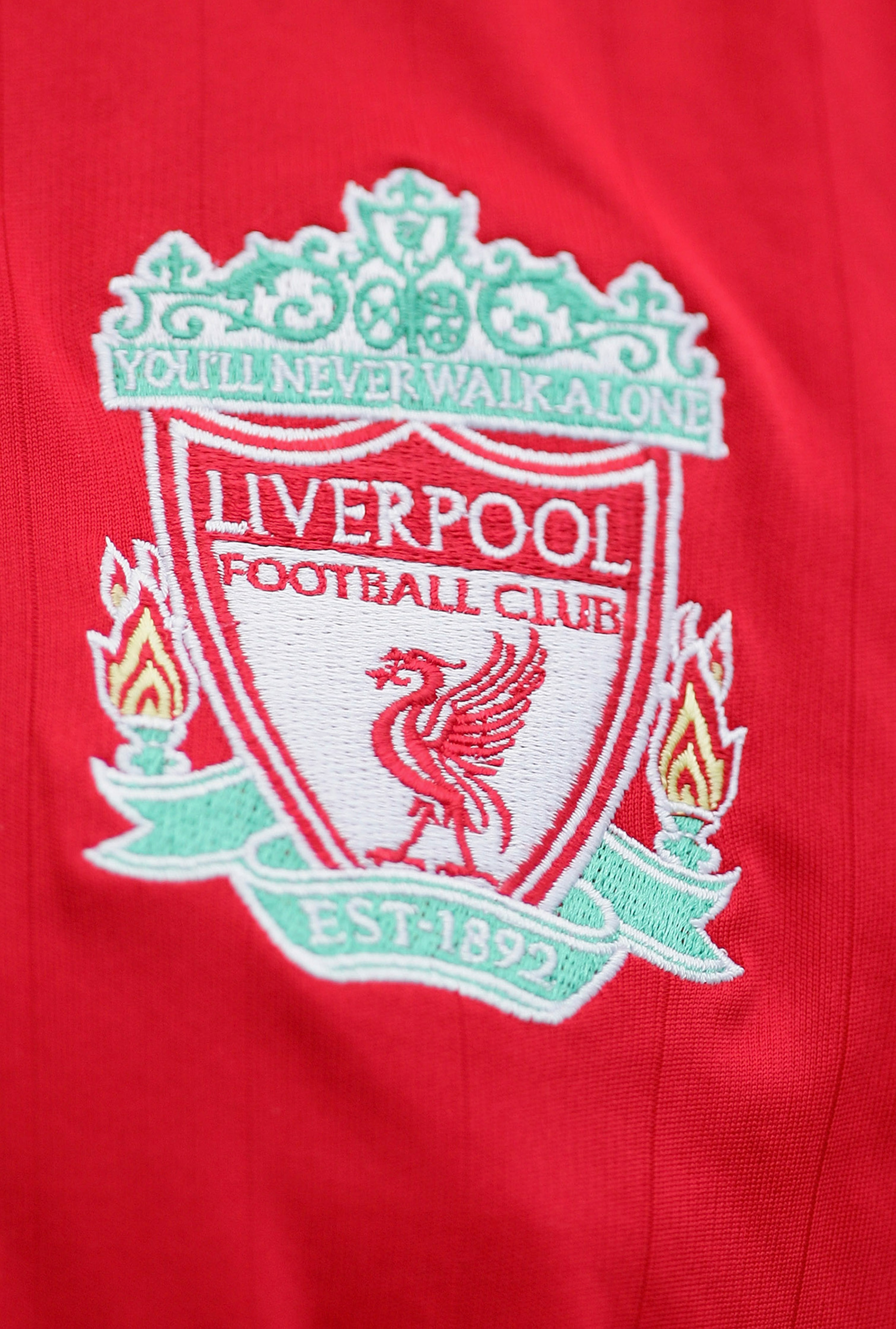 LIVERPOOL, UNITED KINGDOM - SEPTEMBER 23: The Liverpool badge on a fans shirt during the Barclays Premiership match between Liverpool and Tottenham Hotspur at Anfield on September 23, 2006 in Liverpool, England.  (Photo by Laurence Griffiths/Getty Images)