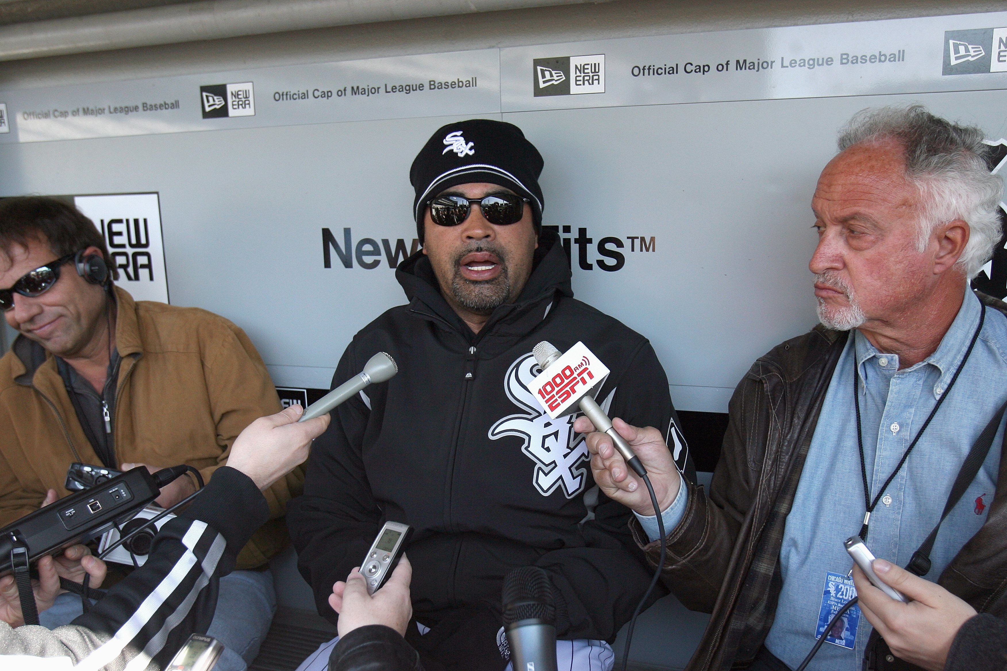 CHICAGO - APRIL 7:  Manager Ozzie Guillen #13 of the Chicago White Sox talks with the press in the dugout before the Opening Day game against the Kansas City Royals on April 7, 2009 at U.S. Cellular Field in Chicago, Illinois. (Photo by Jonathan Daniel/Ge