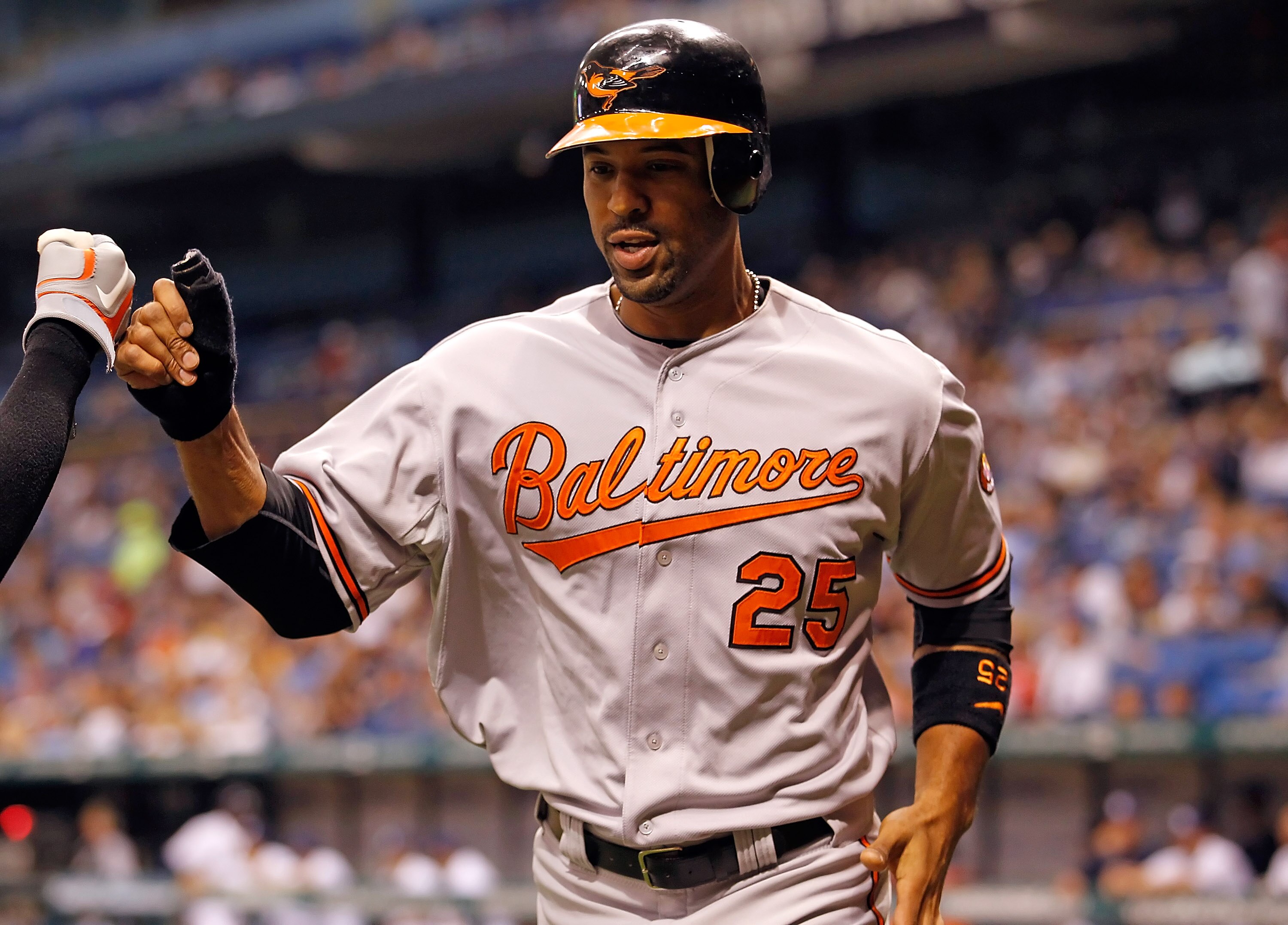 ST PETERSBURG, FL - MAY 14:  Infielder Derrek Lee #25 of the Baltimore Orioles celebrates after scoring against the Tampa Bay Rays during the game at Tropicana Field on May 14, 2011 in St. Petersburg, Florida.  (Photo by J. Meric/Getty Images)