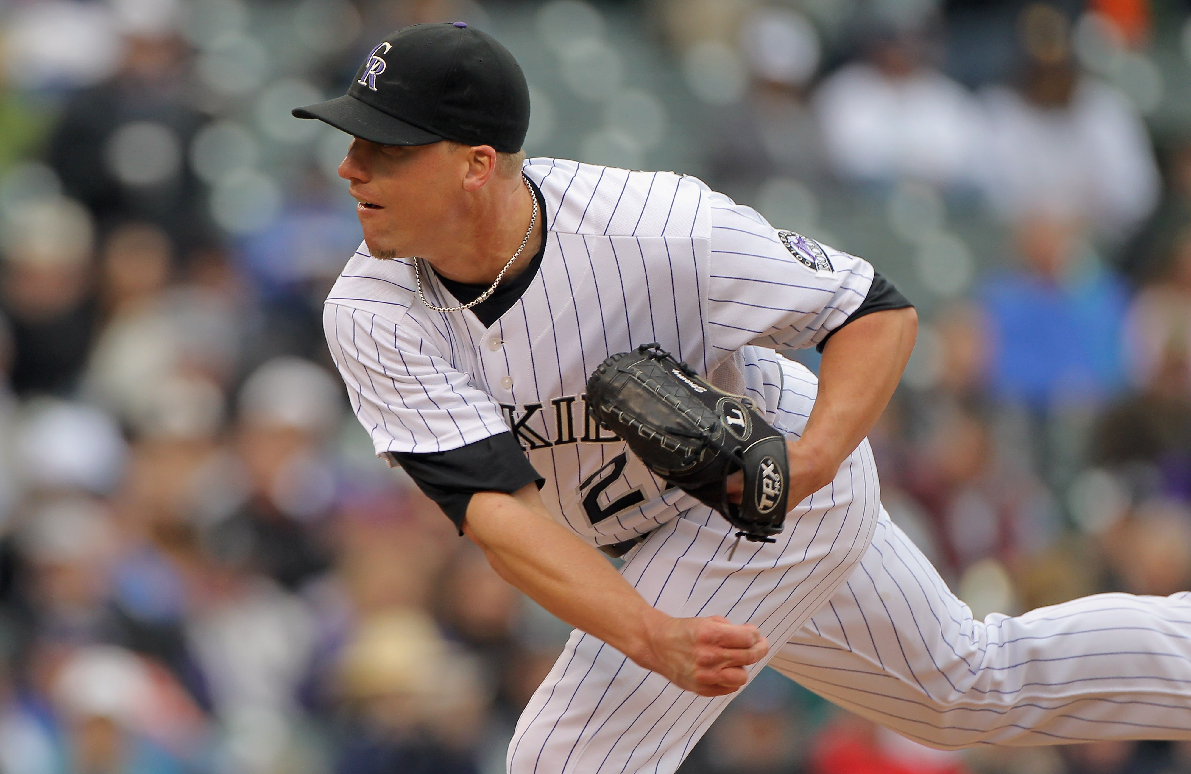 DENVER, CO - APRIL 06:  Relief pitcher Matt Lindstrom #27 of the Colorado Rockies delivers against the Los Angeles Dodgers at Coors Field on April 6, 2011 in Denver, Colorado.  (Photo by Doug Pensinger/Getty Images)