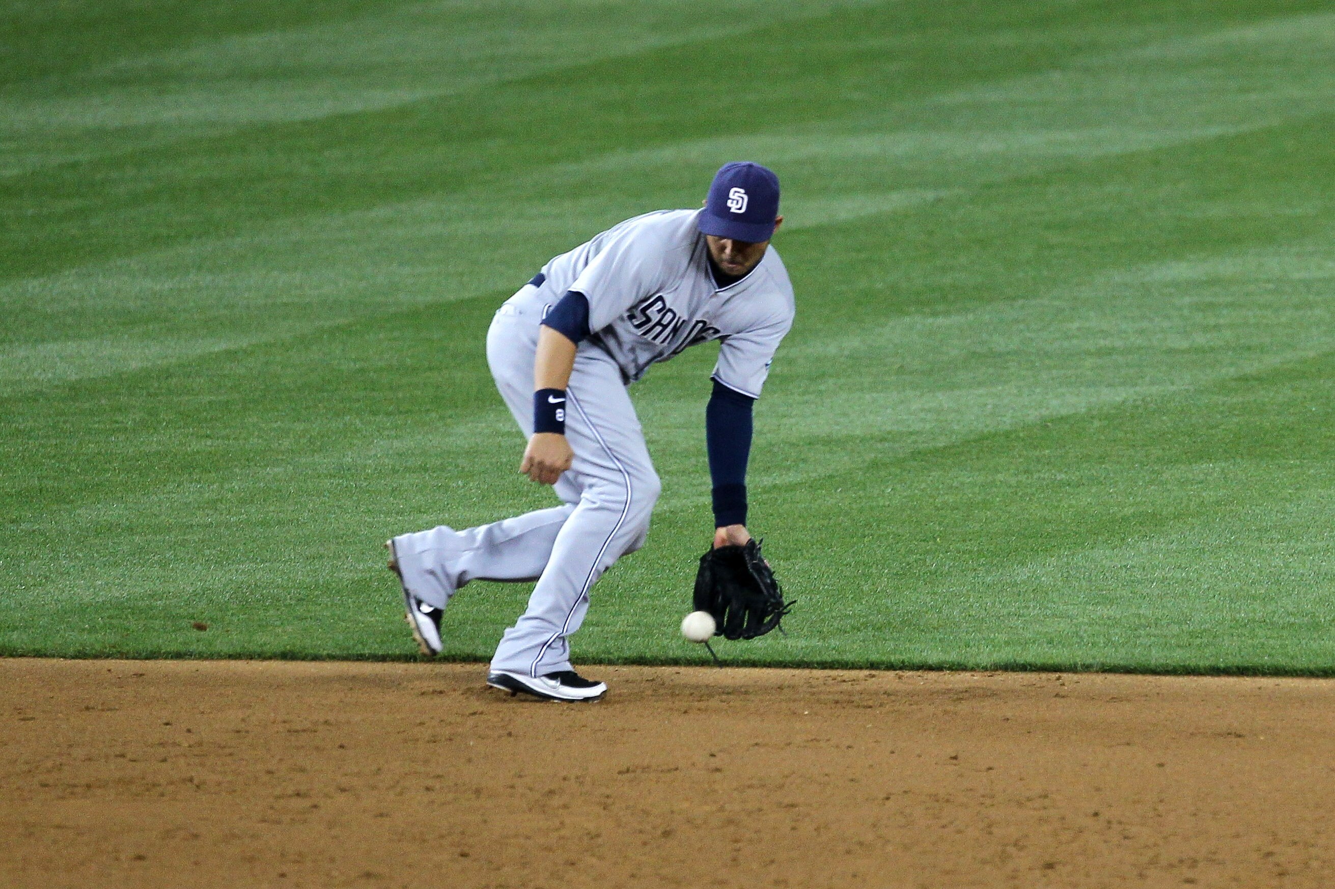 LOS ANGELES - APRIL 29:  Shortstop Jason Bartlett #8 of the San Diego Padres fields a ground ball hit by Matt Kemp of the Los Angeles Dodgers in the fourth inning on April 29, 2011 at Dodger Stadium in Los Angeles, California.  (Photo by Stephen Dunn/Gett