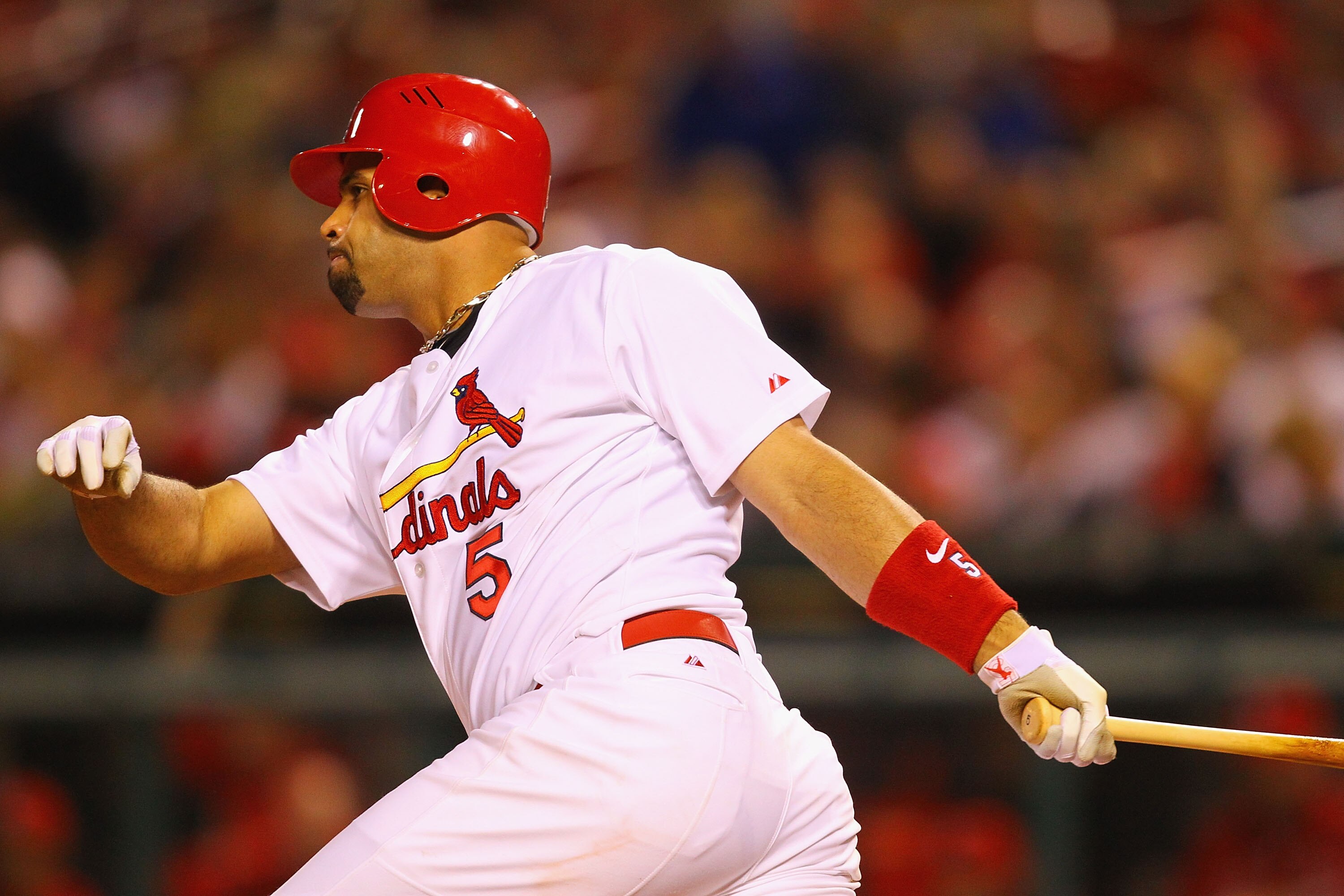 ST. LOUIS, MO - MAY 17: Albert Pujols #5 of the St. Louis Cardinals hits a single against the Philadelphia Phillies at Busch Stadium on May 17, 2011 in St. Louis, Missouri.  (Photo by Dilip Vishwanat/Getty Images)