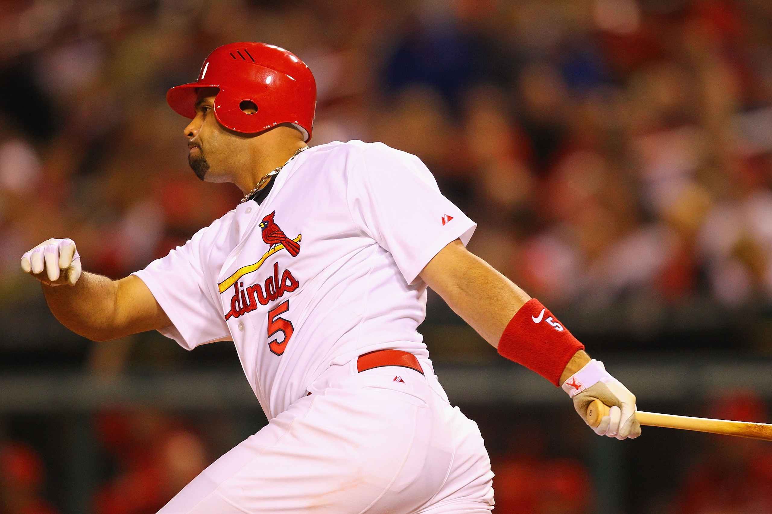 ST. LOUIS, MO - MAY 17: Albert Pujols #5 of the St. Louis Cardinals hits a single against the Philadelphia Phillies at Busch Stadium on May 17, 2011 in St. Louis, Missouri.  (Photo by Dilip Vishwanat/Getty Images)