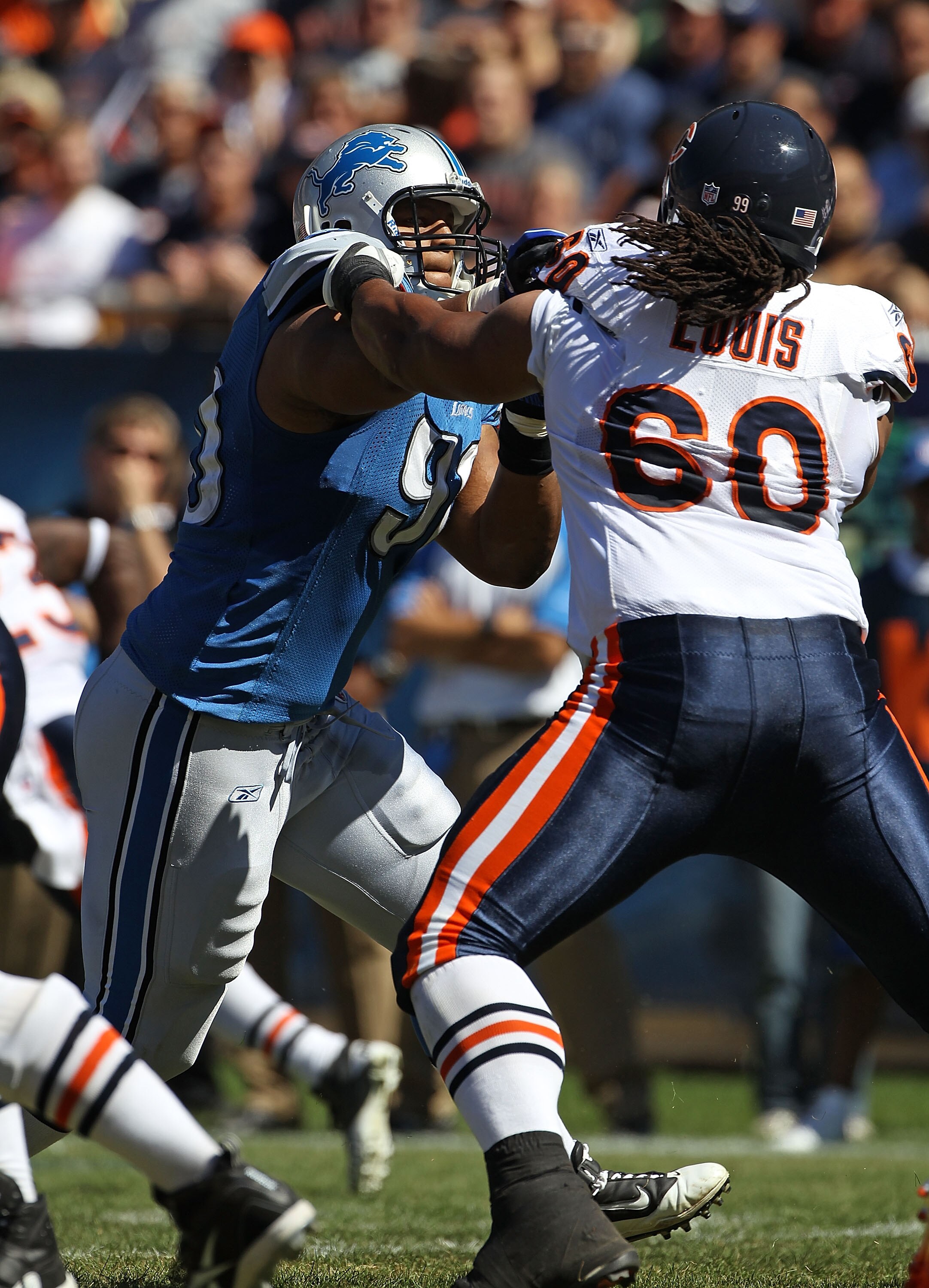 CHICAGO - SEPTEMBER 12: Ndamukong Suh #90 of the Detroit Lions rushes against Lance Louis #60 of the Chicago Bears during the NFL season opening game at Soldier Field on September 12, 2010 in Chicago, Illinois. The Bears defeated the Lions 19-14.  (Photo