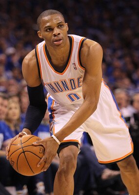 OKLAHOMA CITY, OK - MAY 21:  Russell Westbrook #0 of the Oklahoma City Thunder looks to pass the ball while taking on the Dallas Mavericks in Game Three of the Western Conference Finals during the 2011 NBA Playoffs at Oklahoma City Arena on May 21, 2011 i
