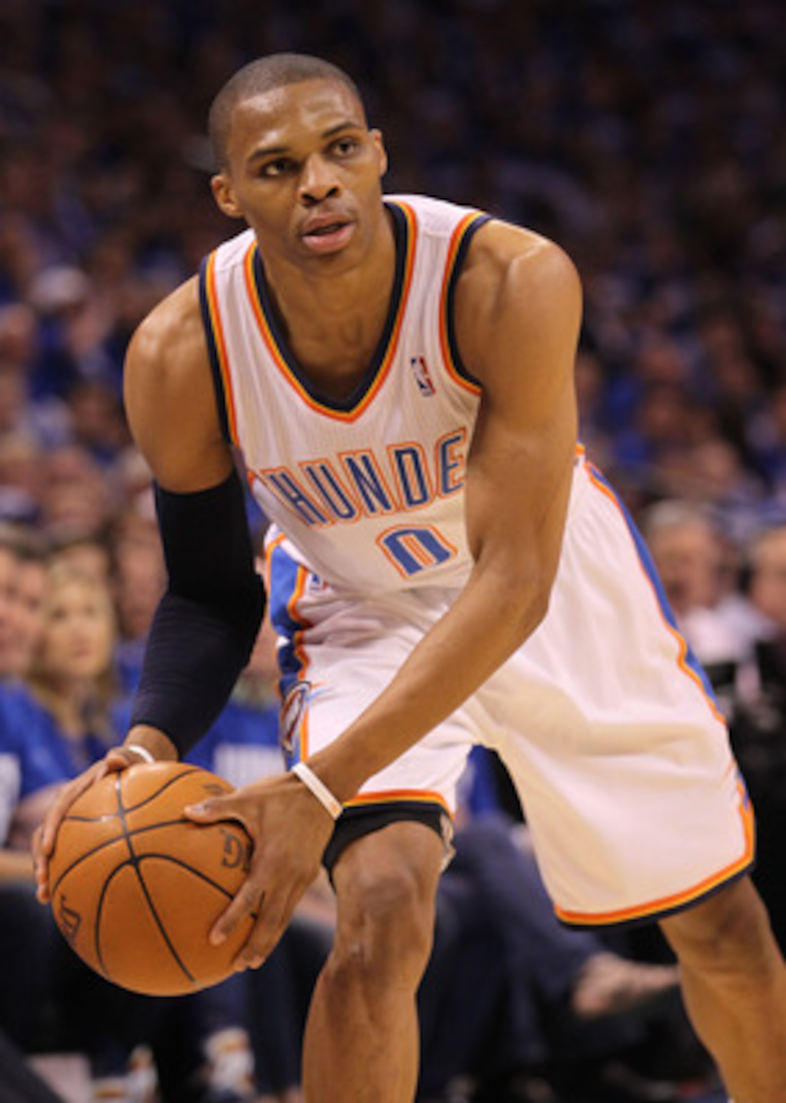OKLAHOMA CITY, OK - MAY 21:  Russell Westbrook #0 of the Oklahoma City Thunder looks to pass the ball while taking on the Dallas Mavericks in Game Three of the Western Conference Finals during the 2011 NBA Playoffs at Oklahoma City Arena on May 21, 2011 i