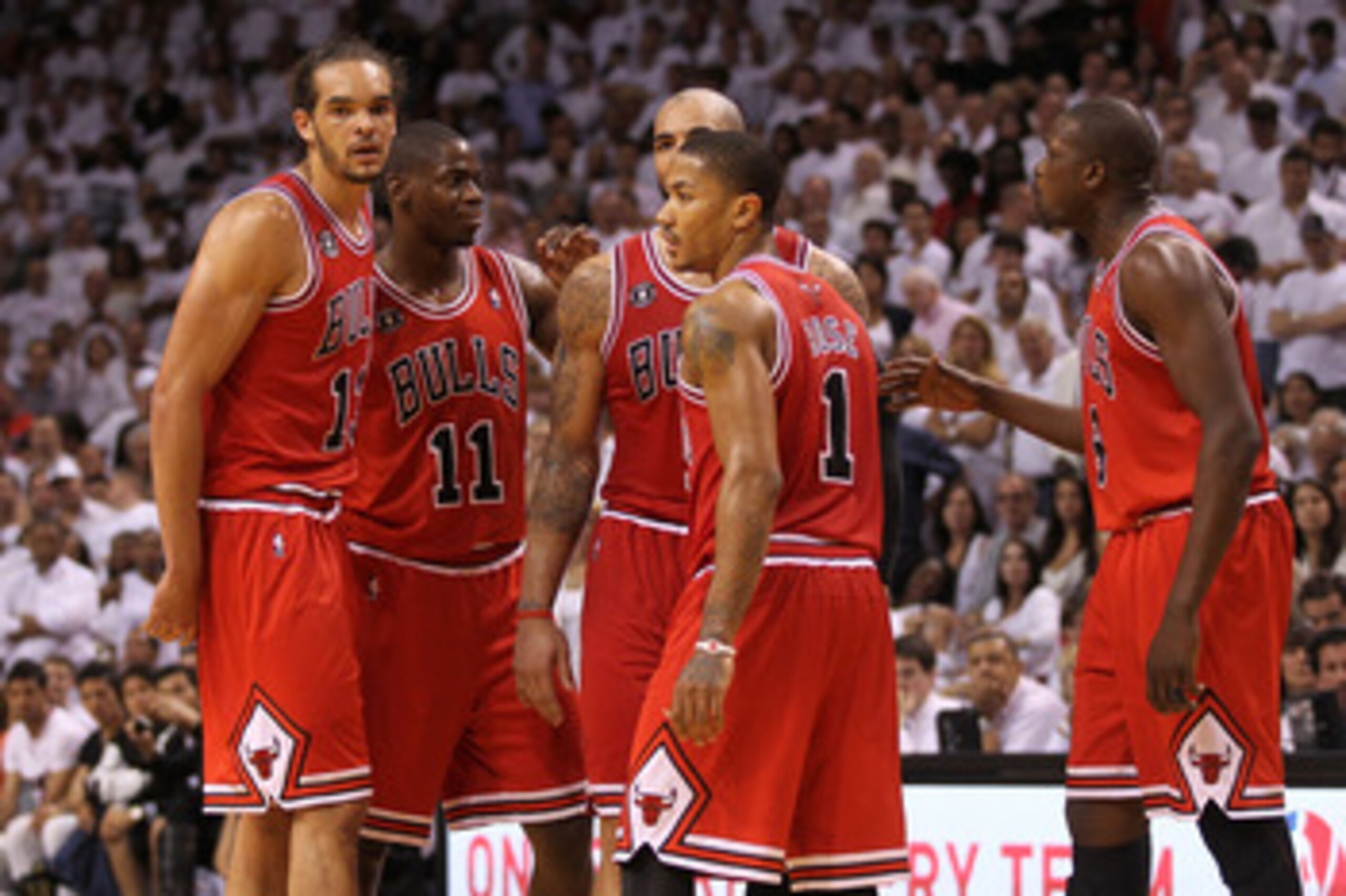 MIAMI, FL - MAY 24: (L-R) Joakim Noah #13, Ronnie Brewer #11, Carlos Boozer #5, Derrick Rose #1 and Luol Deng #9 of the Chicago Bulls look on against the Miami Heat in Game Four of the Eastern Conference Finals during the 2011 NBA Playoffs on May 24, 2011