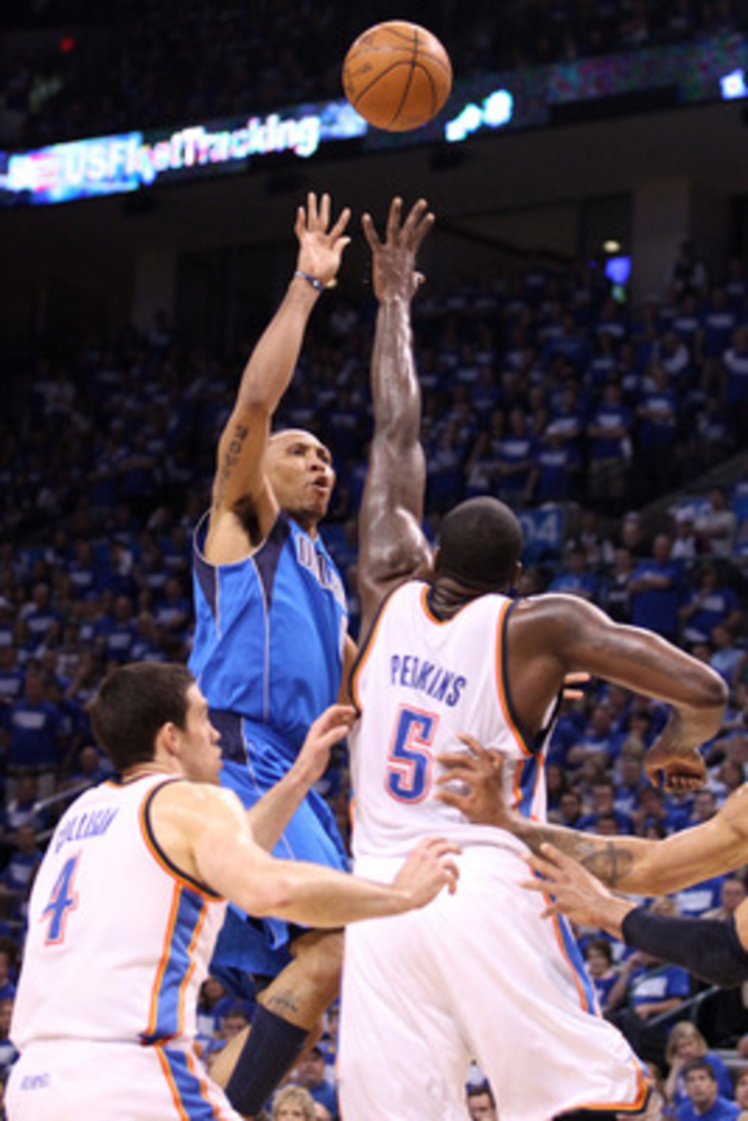OKLAHOMA CITY, OK - MAY 21:  Shawn Marion #0 of the Dallas Mavericks shoots the ball over Kendrick Perkins #5 of the Oklahoma City Thunder in the first quarter in Game Three of the Western Conference Finals during the 2011 NBA Playoffs at Oklahoma City Ar